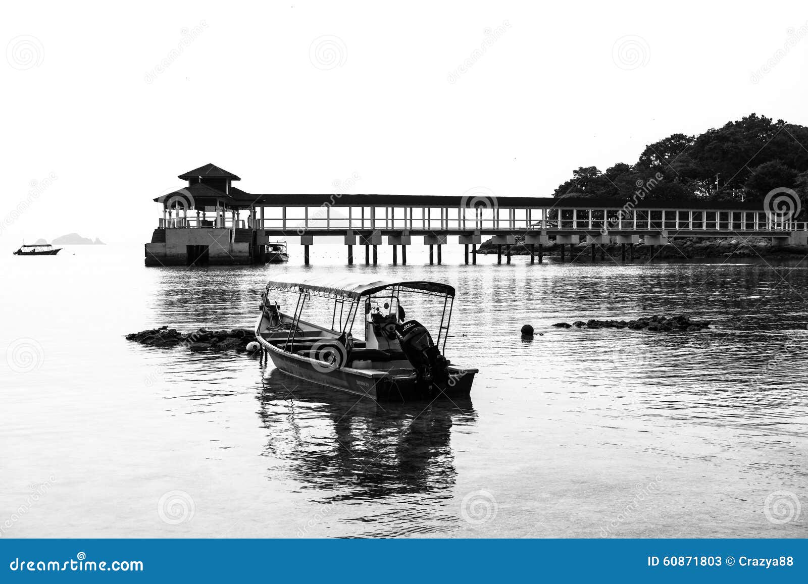black and white of jetty and fishing boats, coral bay, perhentian island kecil, malaysia