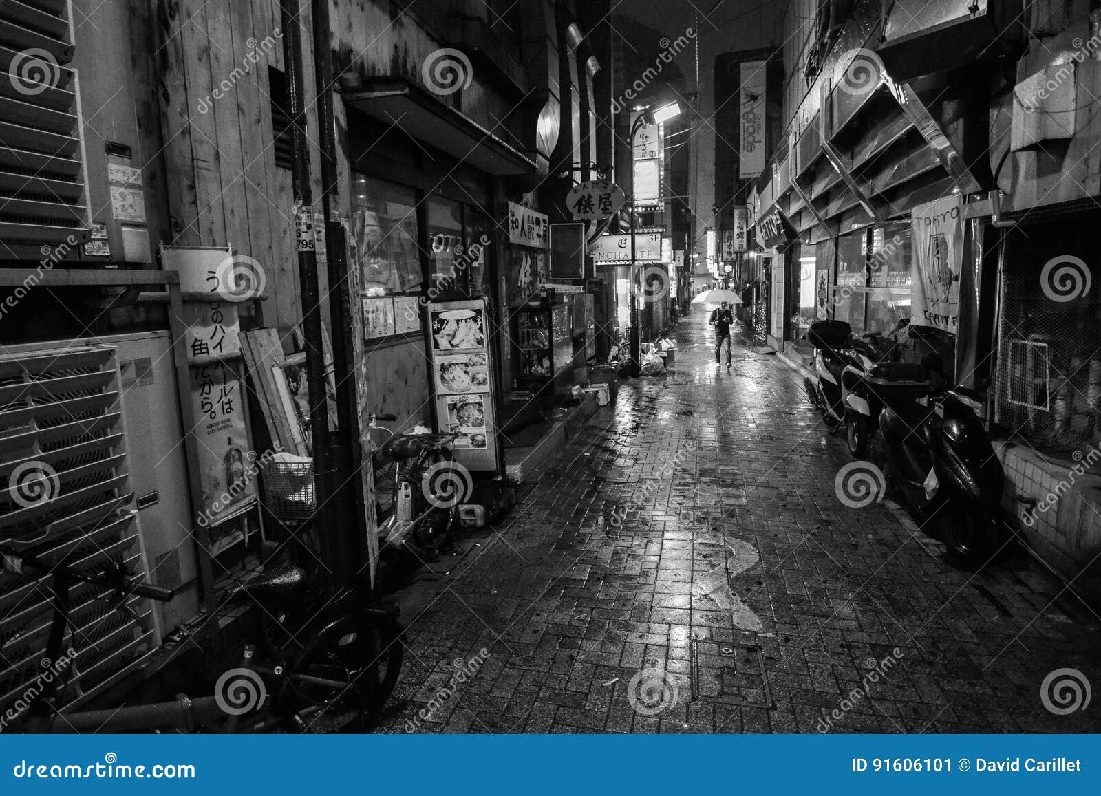 Black And White Of A Man With An Umbrella Walking Down A Lonely Alleyway On A Rainy Night In Tokyo Editorial Photo Image Of Alone Evening