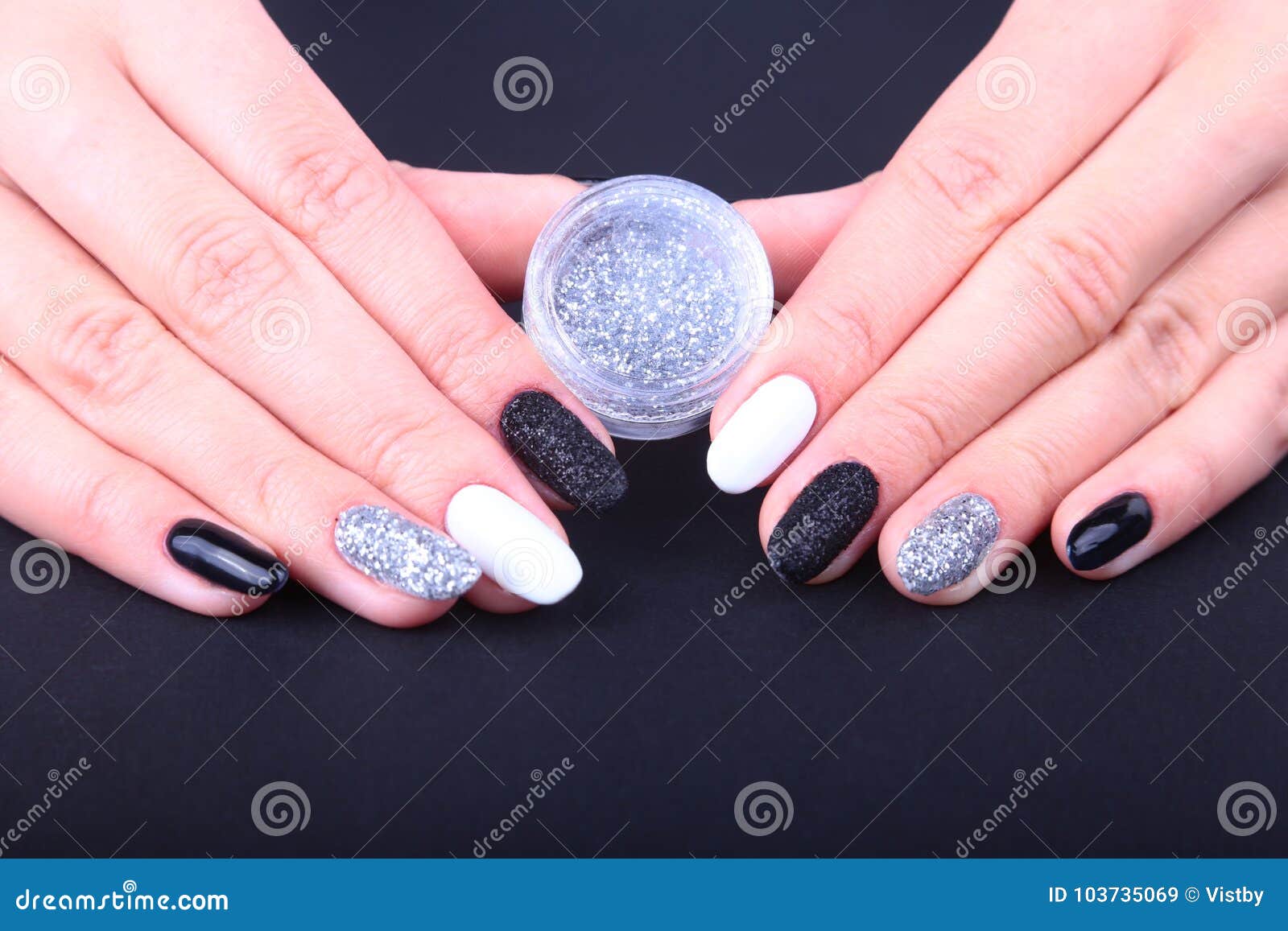 Woman giving herself elegant manicure at home Stock Photo by ©Khakimullin  524010338