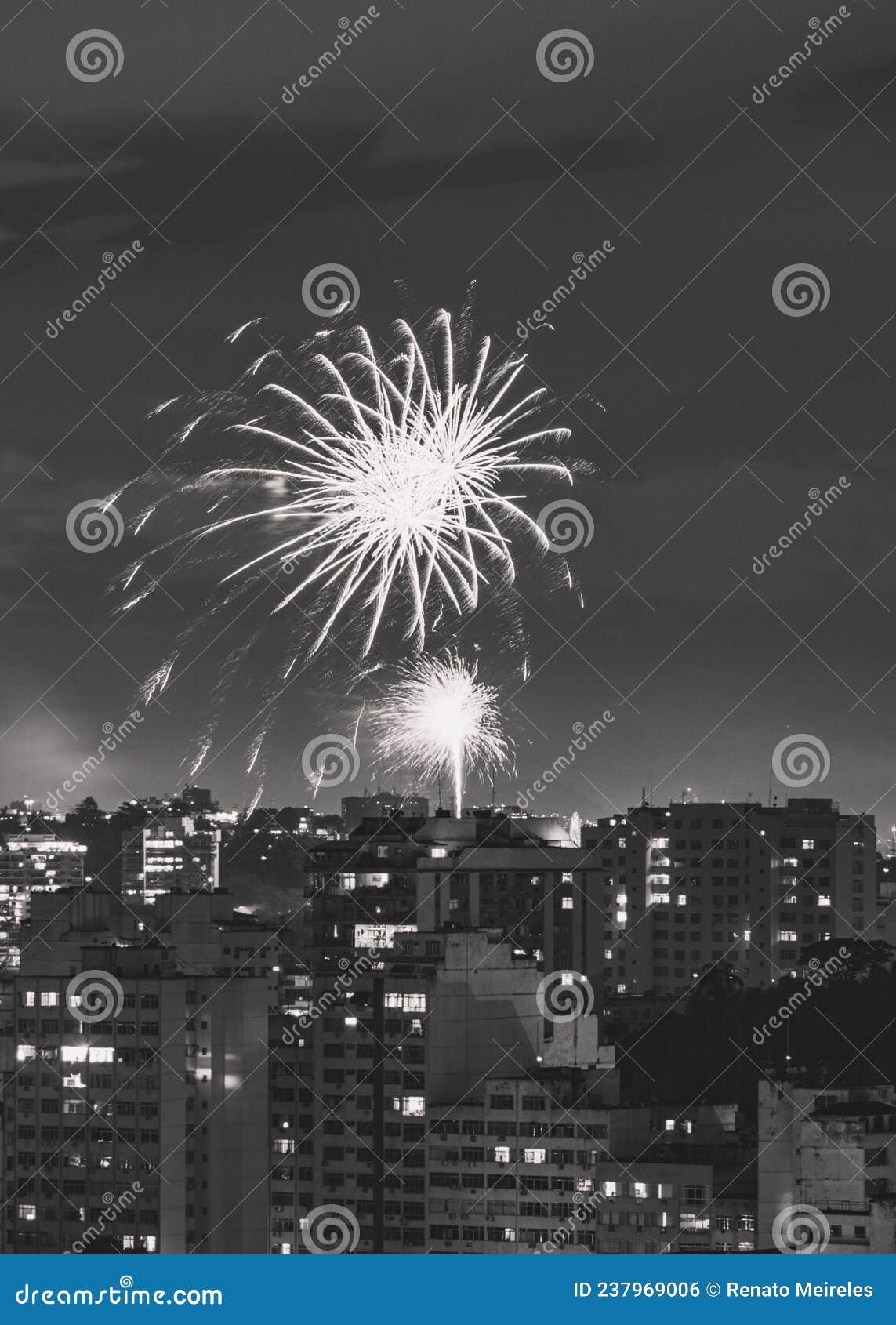 black and white nighttime images with new year`s, rÃÂ©veillon, fireworks exploding in the sky. event held for the 2022 arrival