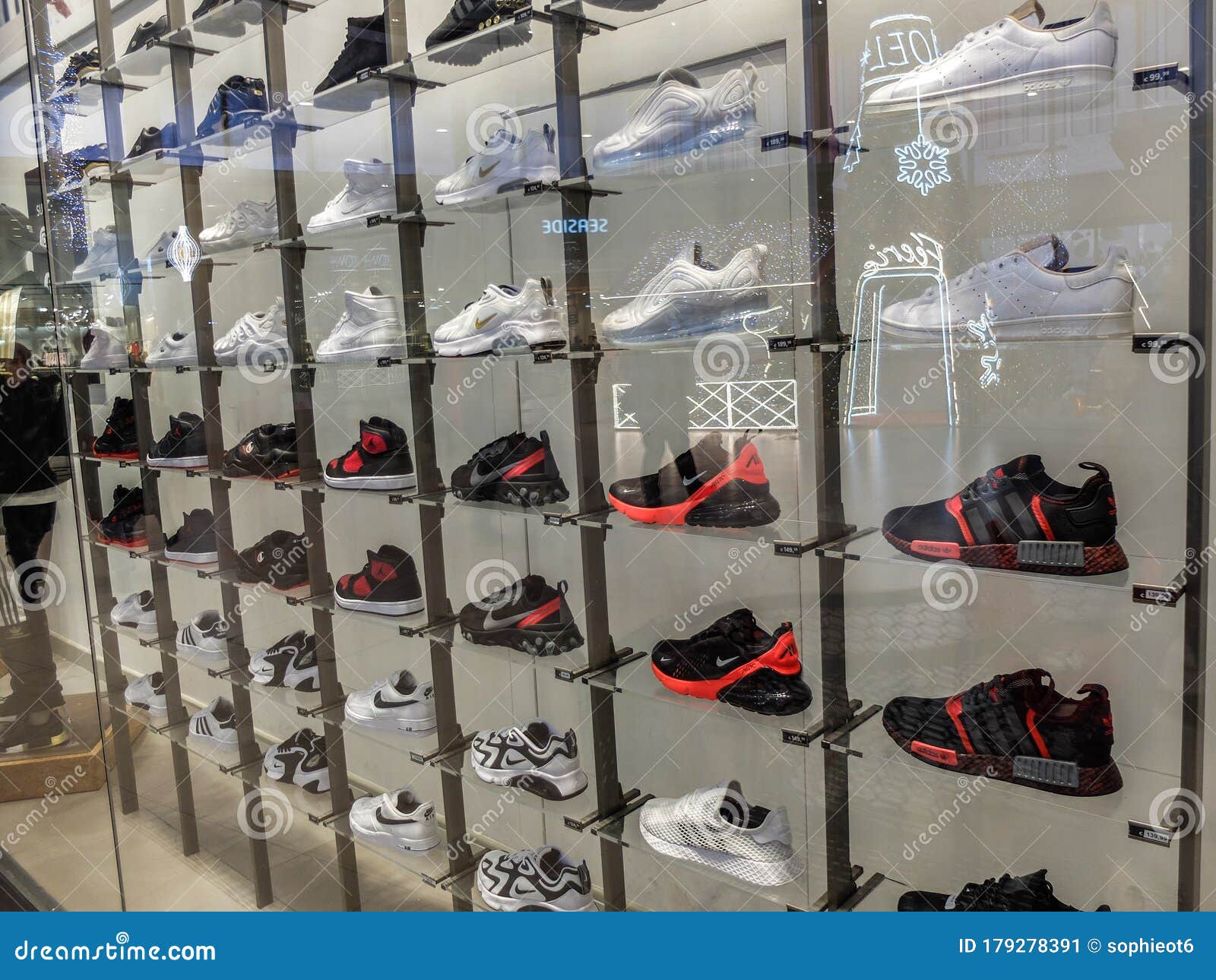 Black and White Nike Sneakers in a Display Window Editorial Photo ...