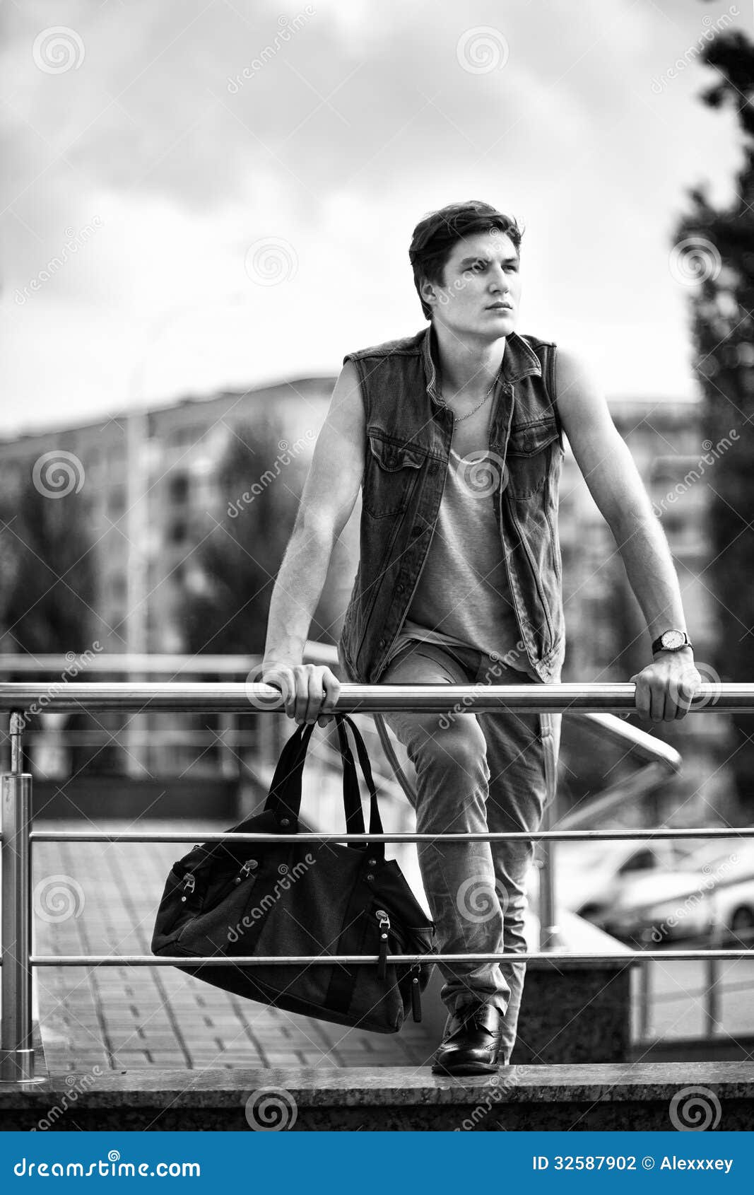 Black and White Photo of the Fashion Guy with a Bag Standing in Stock ...