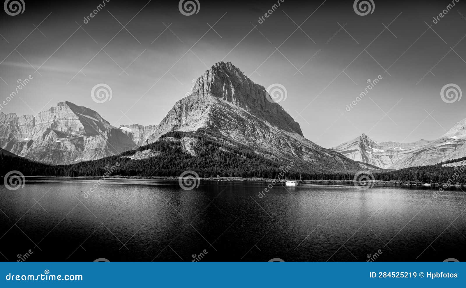 black and white photo of swiftcurrent lake and grinnell point in glacier national park