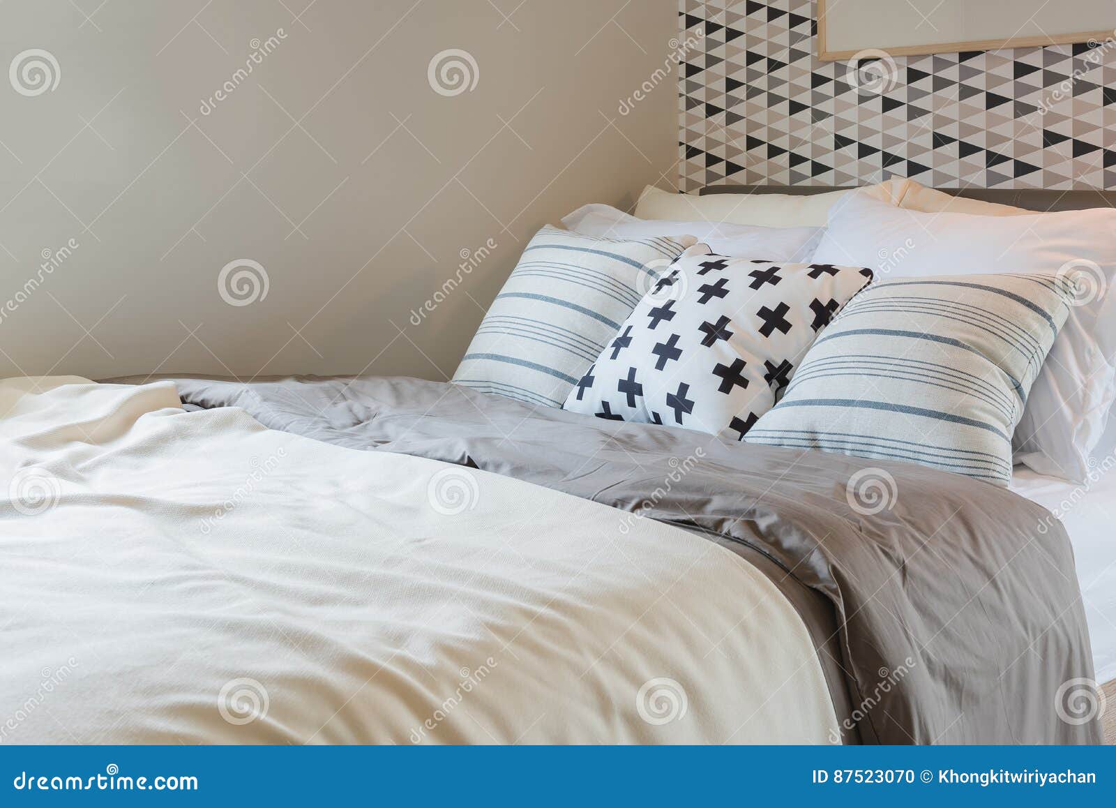 Black and White Pillows Color Set on Bed in Modern Bedroom Stock Photo