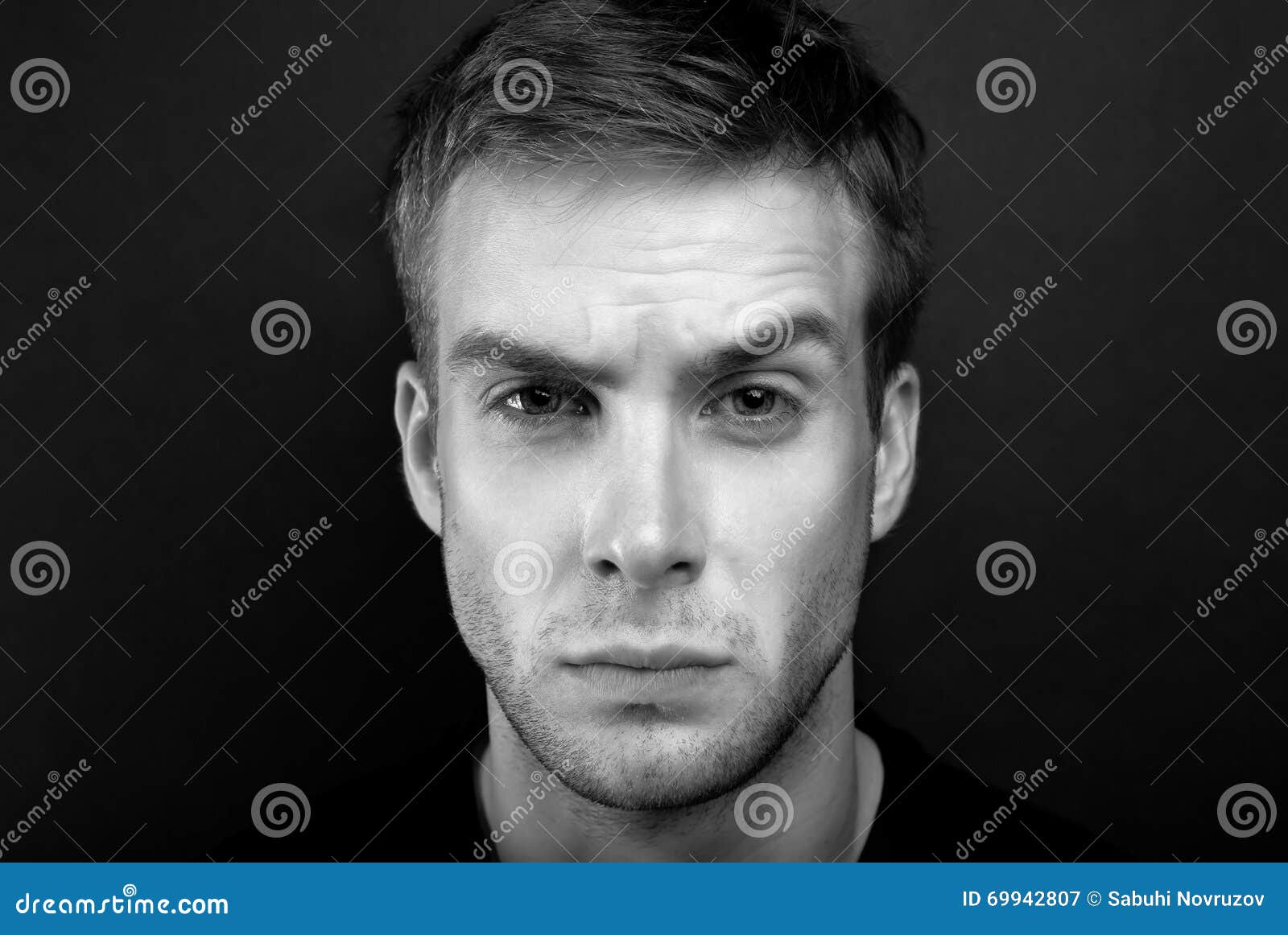 Black and White Portrait Photo of Young Man with Angry Look in V Stock ...