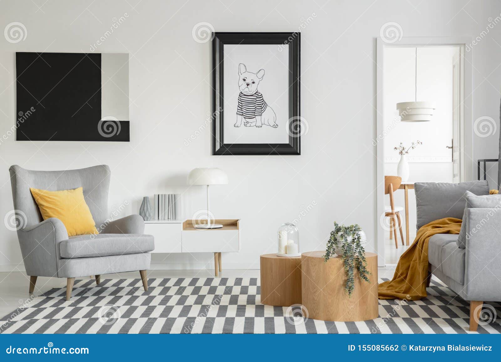black and white poster of dog on the wall of fashionable living room interior with two wooden coffee tables with flowers