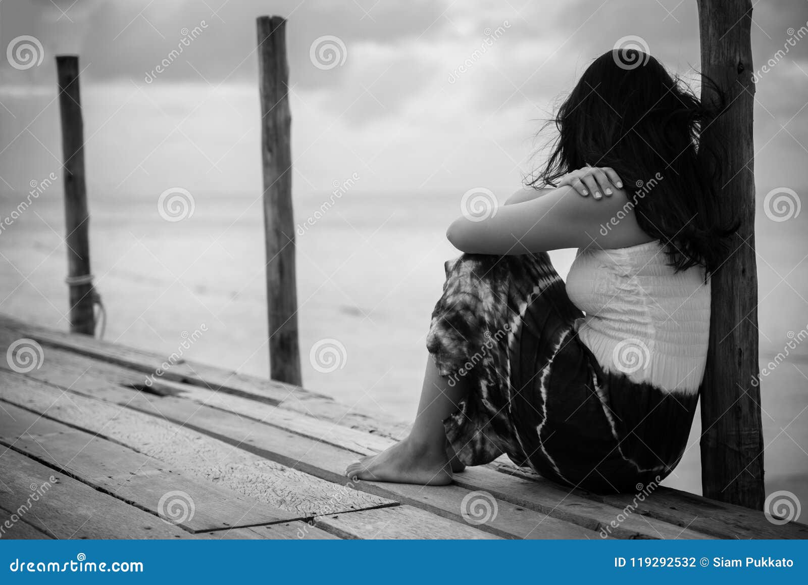 Black and White of Sad and Lonely Woman Sitting Alone Stock Photo ...