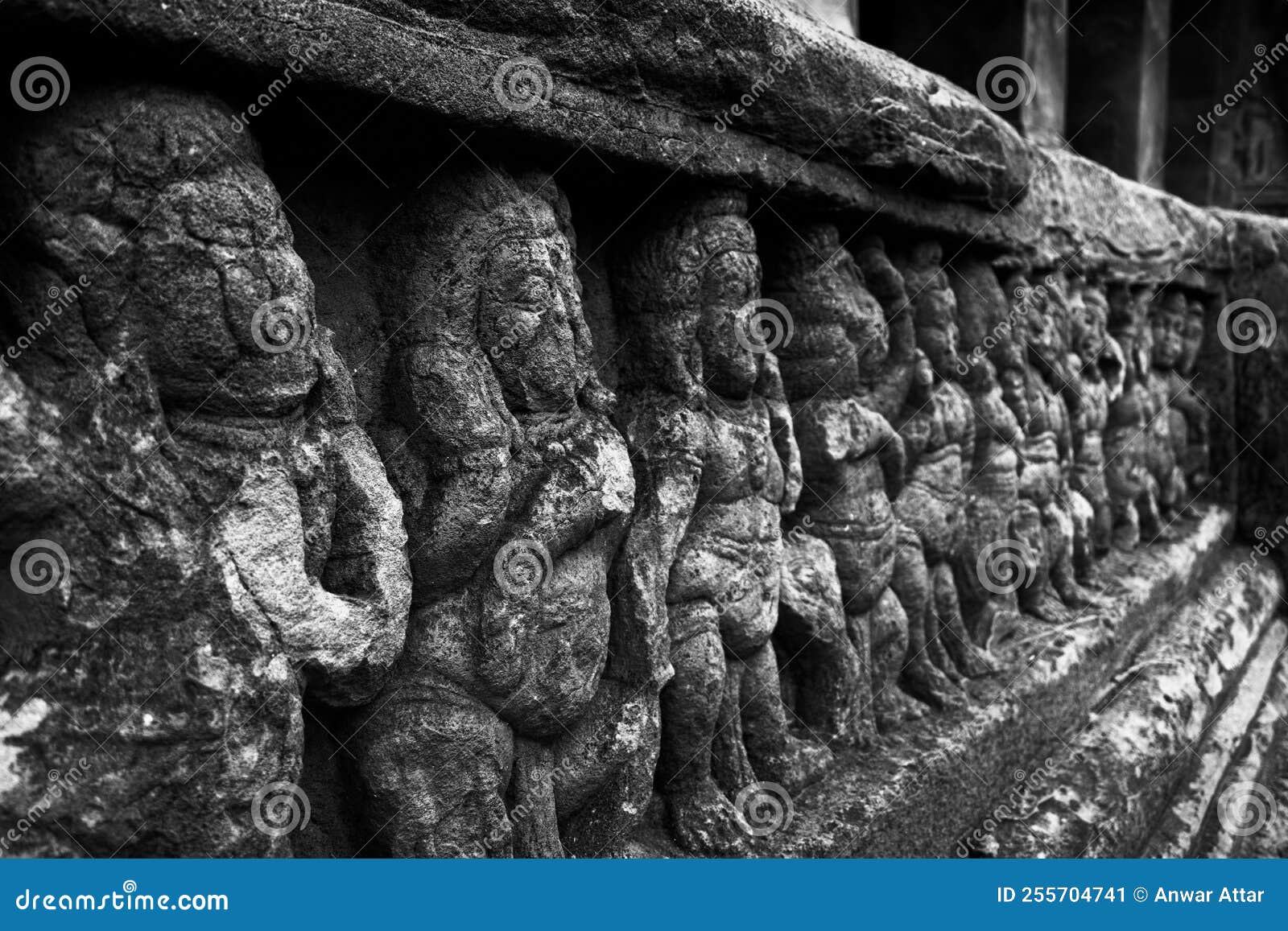 black and white shot of dancing ganas sculptures with selective focus at badami