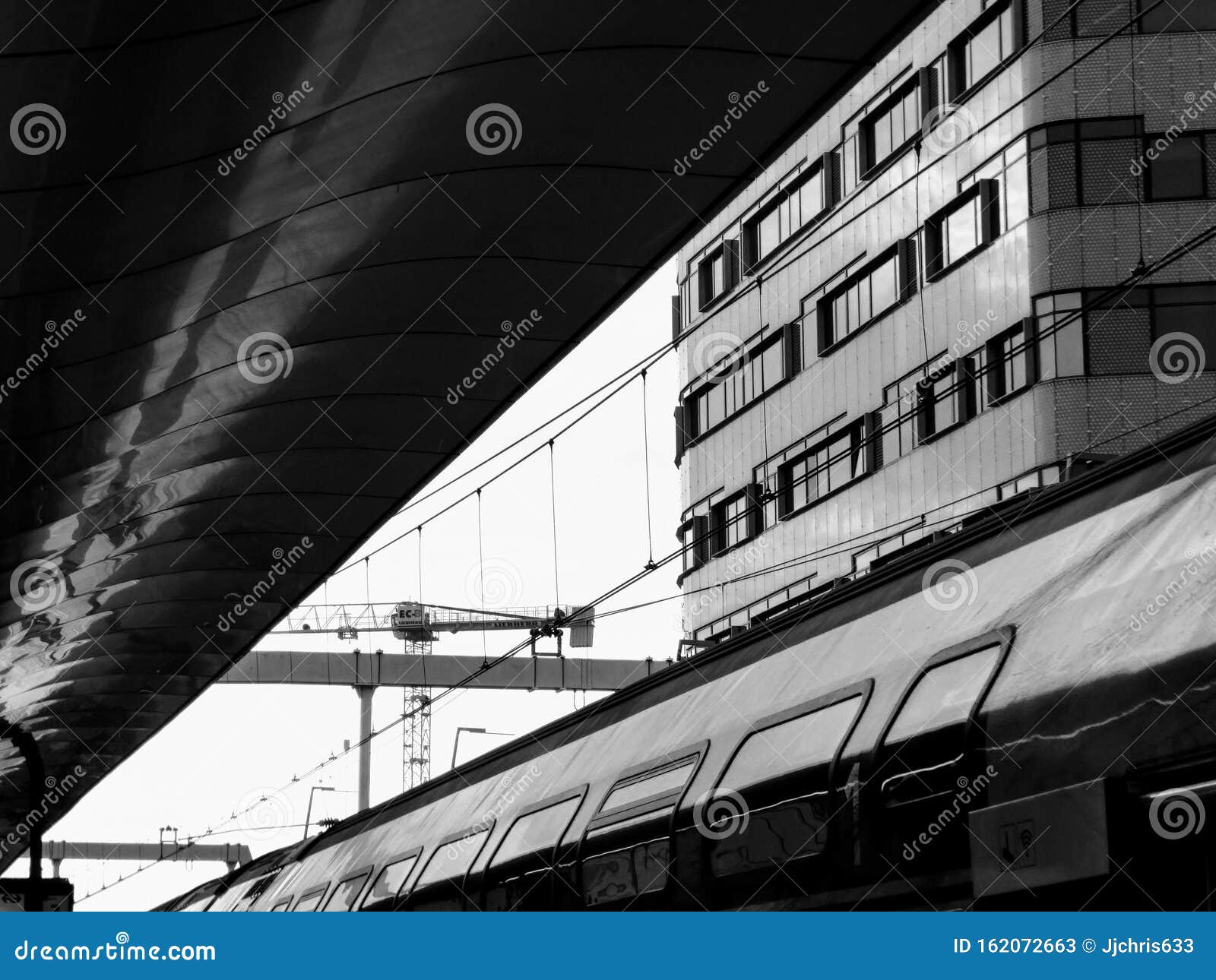 Black and White Train Photo on Station. Architecture and Cables. Stock
