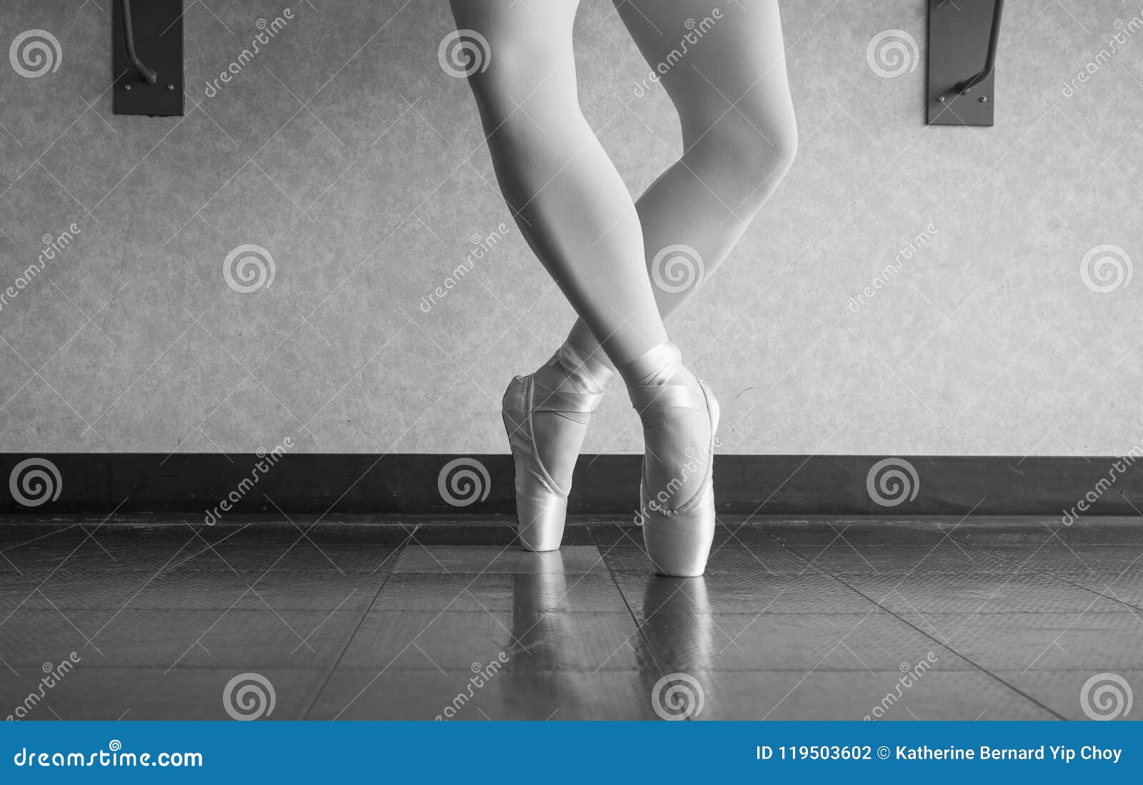 black and white version of ballerina dancer in the ballet studio en pointe in releve fourth position