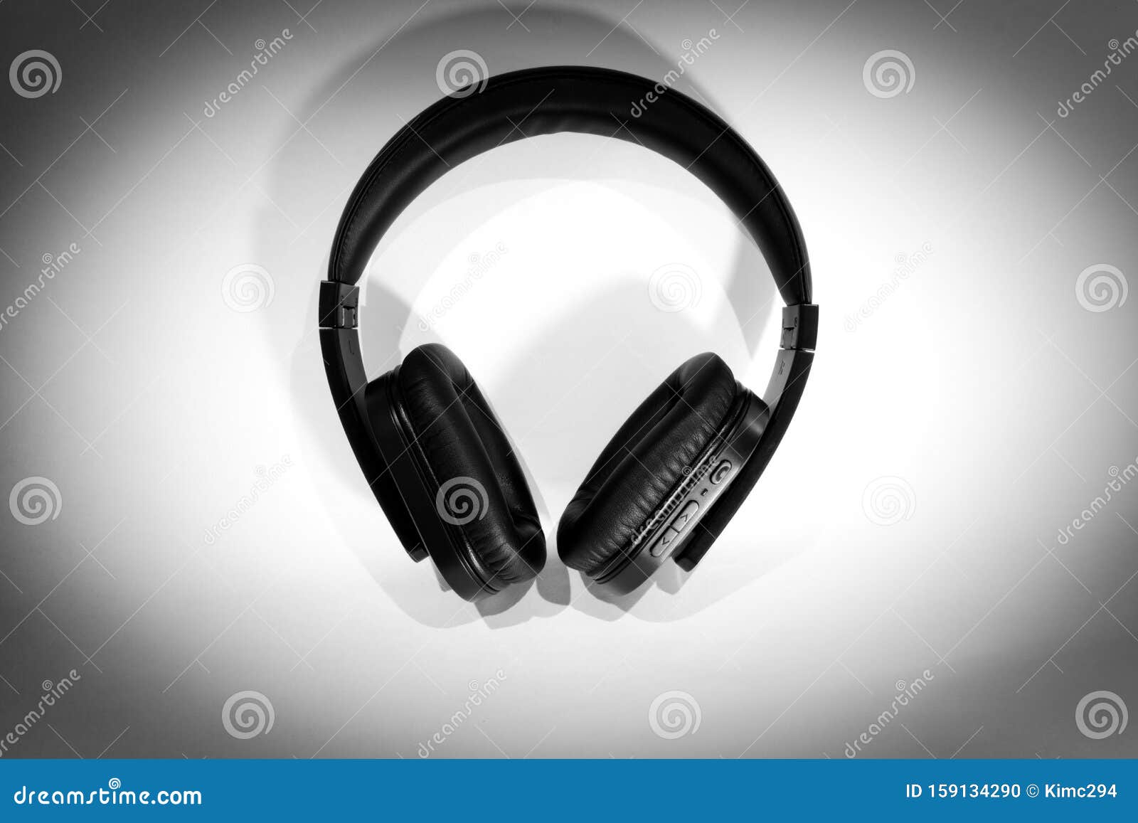 Black Wireless Headphones on White Background with Dark Vignette ...