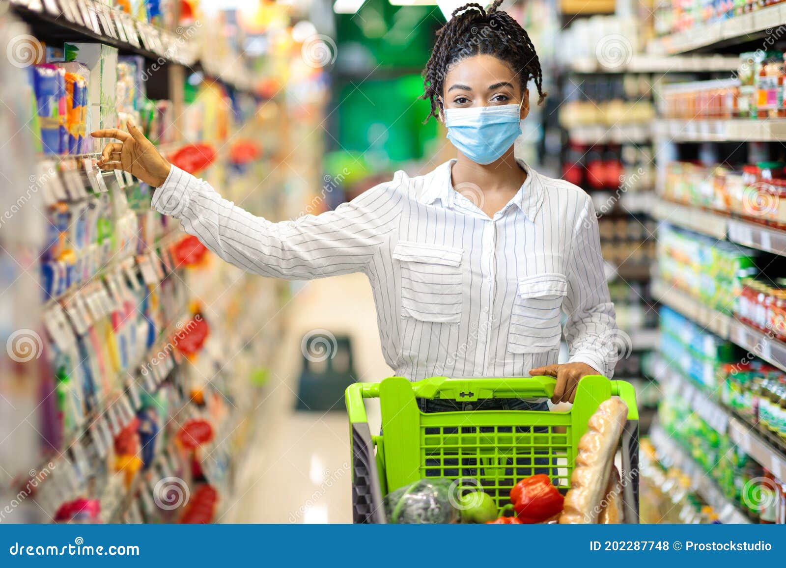 Black Woman Taking Food Product Doing Grocery Shopping in Supermarket ...