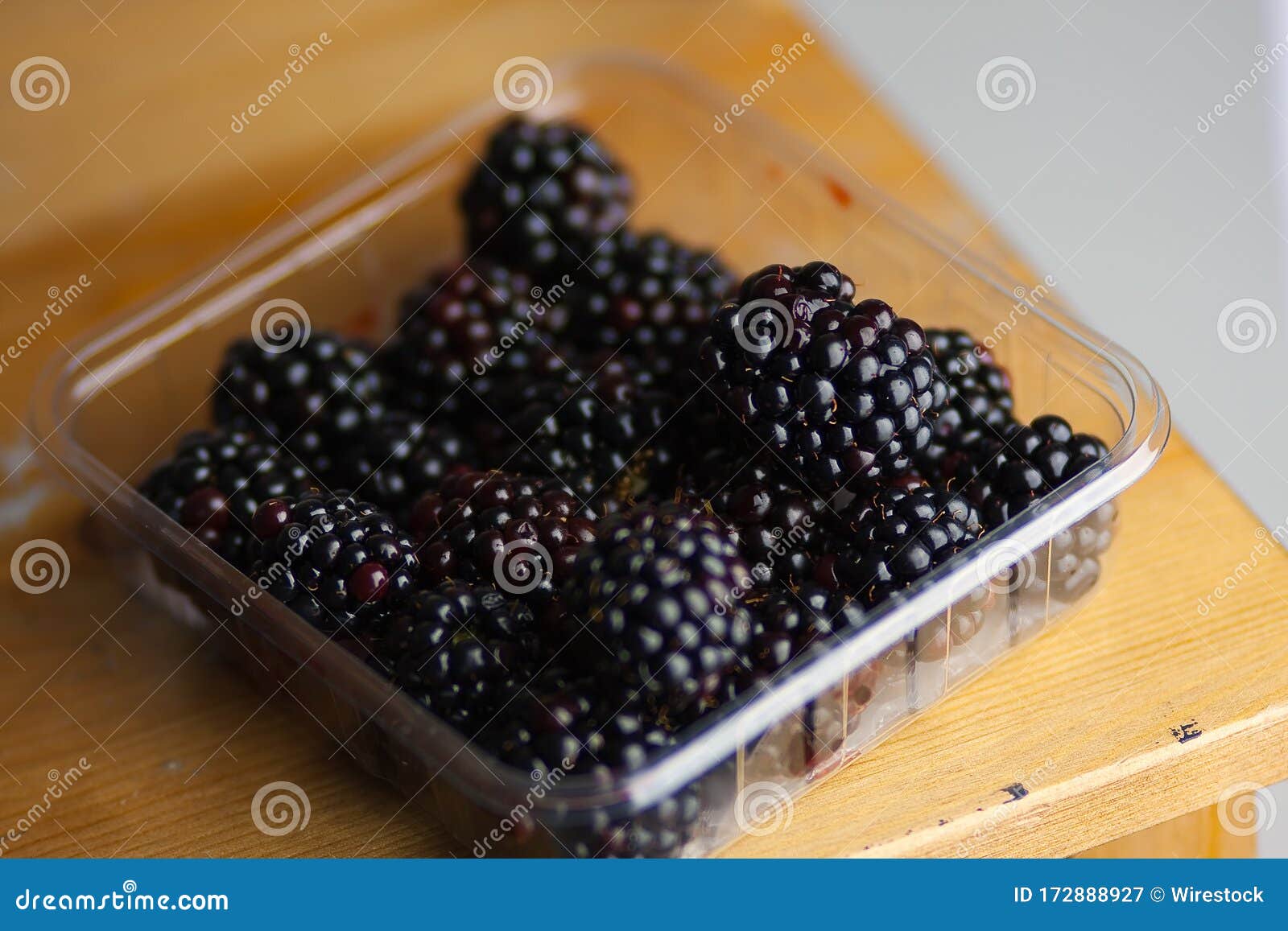 Blackberries on Top of Each Other in a Plastic Container Stock Image