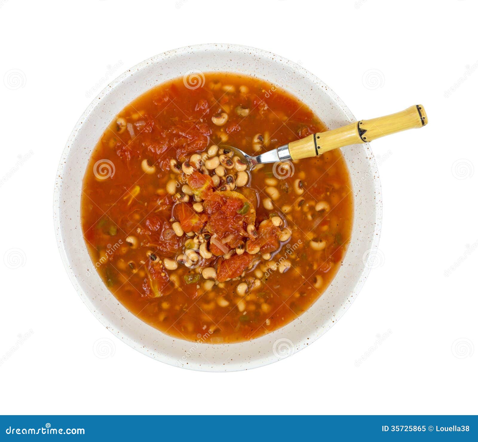 blackeye peas soup in shallow bowl top view with spoon