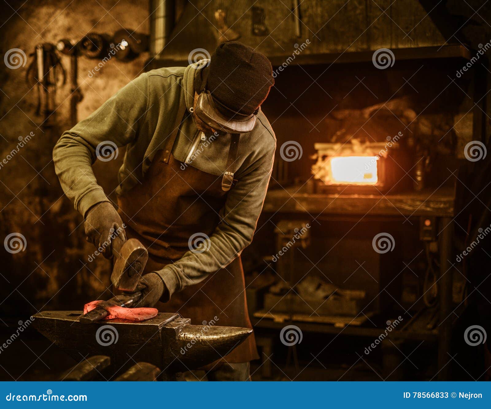 The Blacksmith the Molten Metal on the Anvil in Smithy Stock