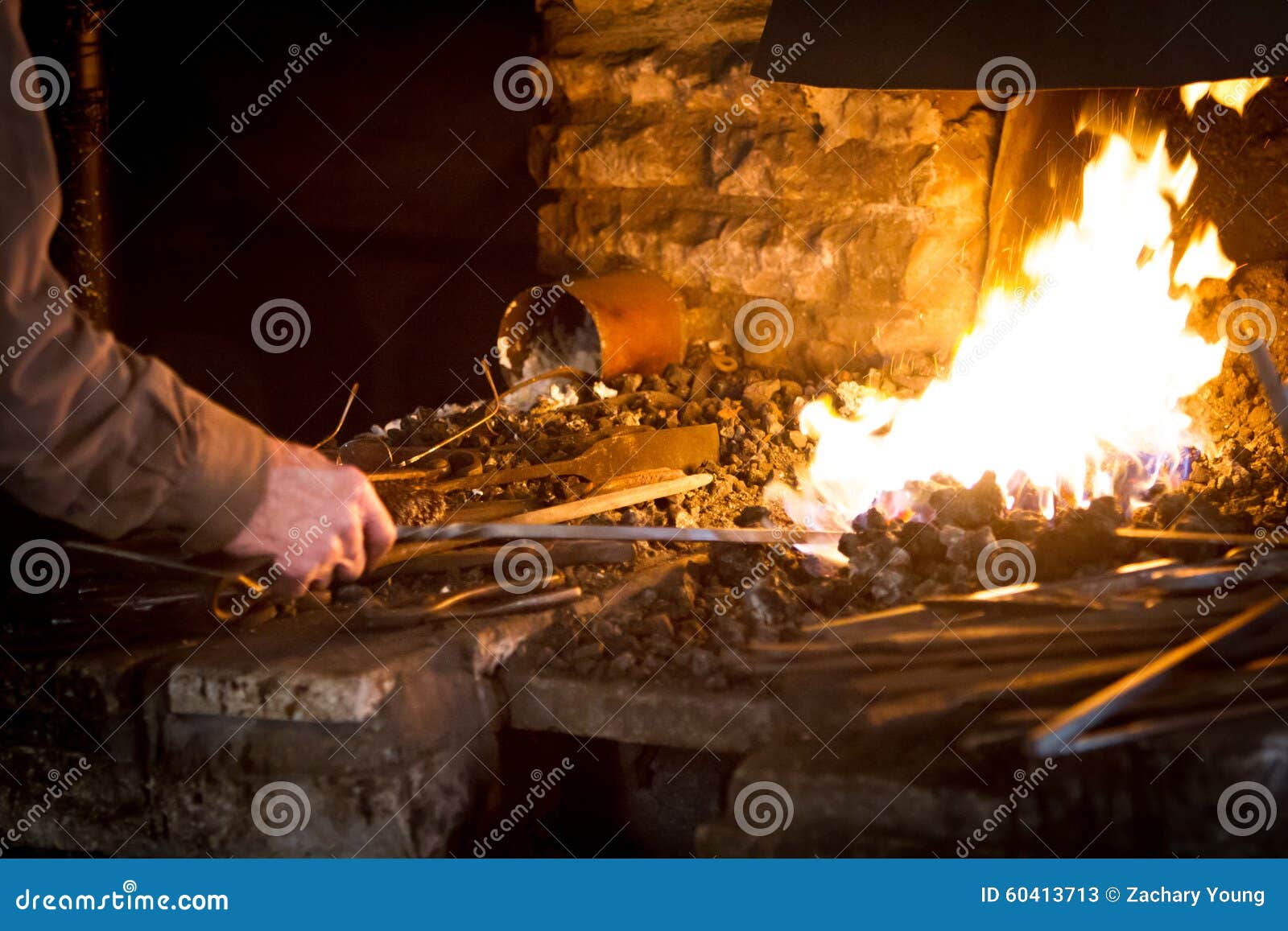 Blacksmith Heating a Metal Rod Stock Image Image of metalwork, hammer