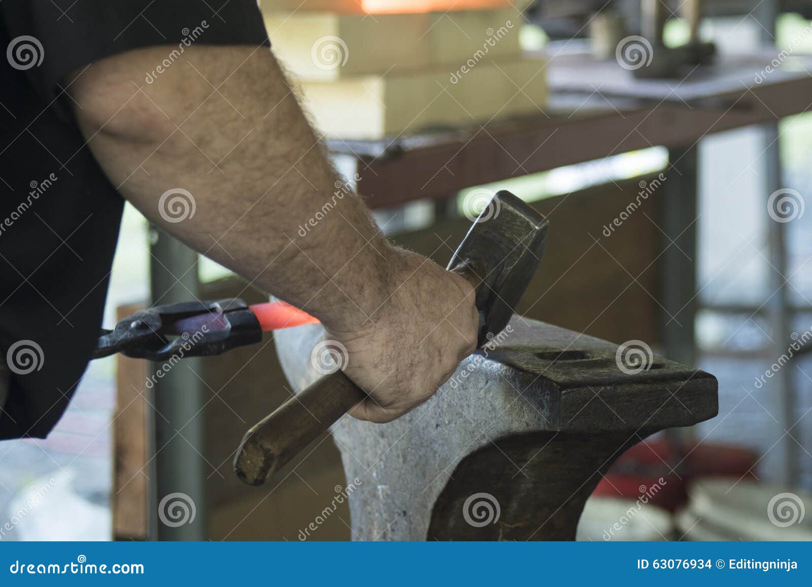 bladesmith with hammer