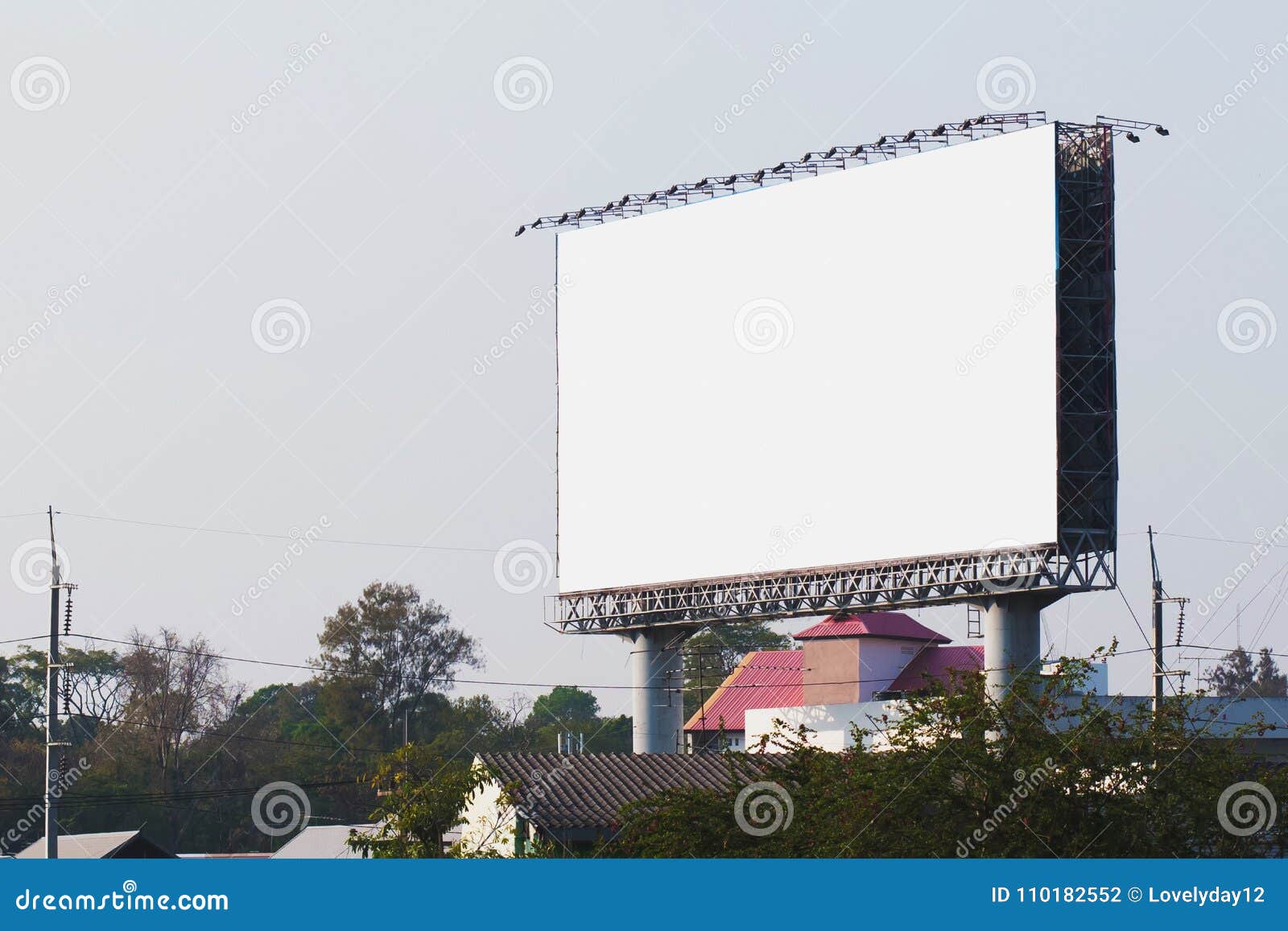 blank billboards in city with blue sky