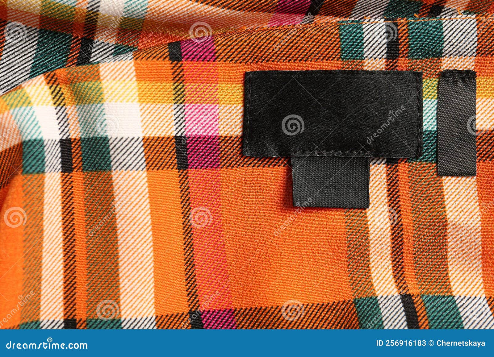 Blank Clothing Label on Checkered Apparel, Top View. Space for Text