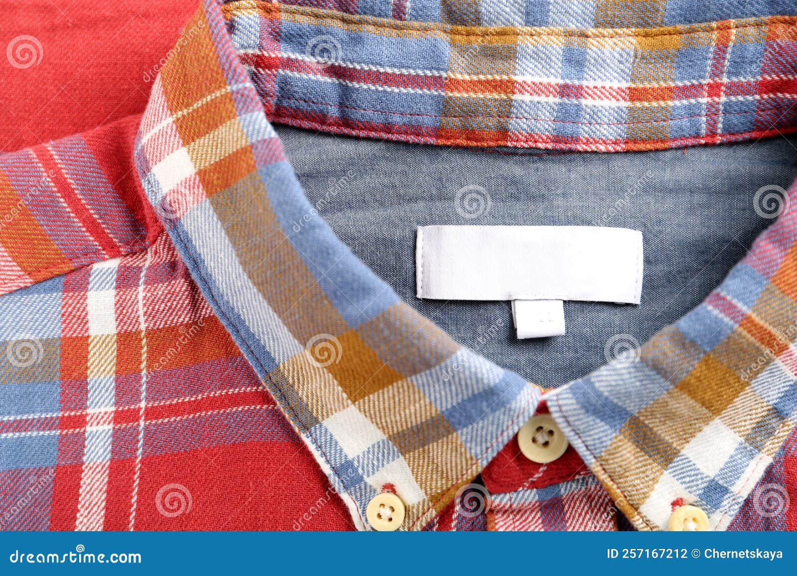 Blank Clothing Label on Checkered Shirt, Top View Stock Photo Image