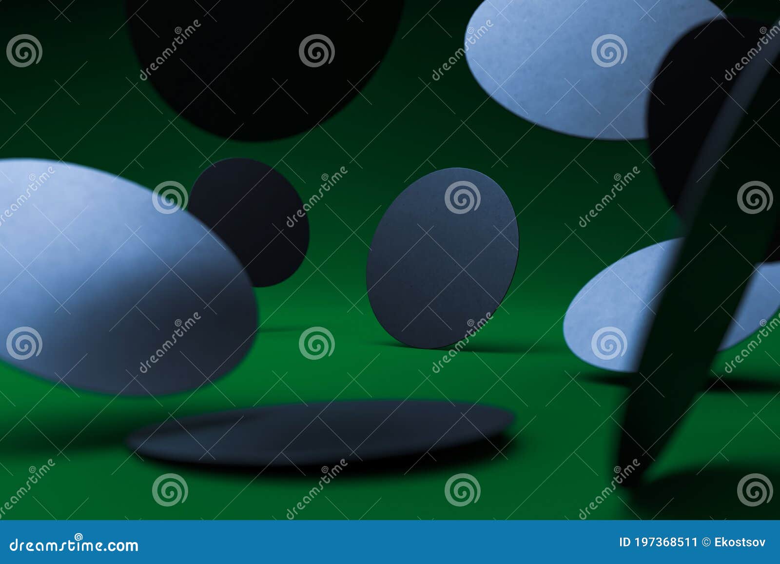 blank falling black round beer coasters templates on green background. copy space. empty space, 3d rendering
