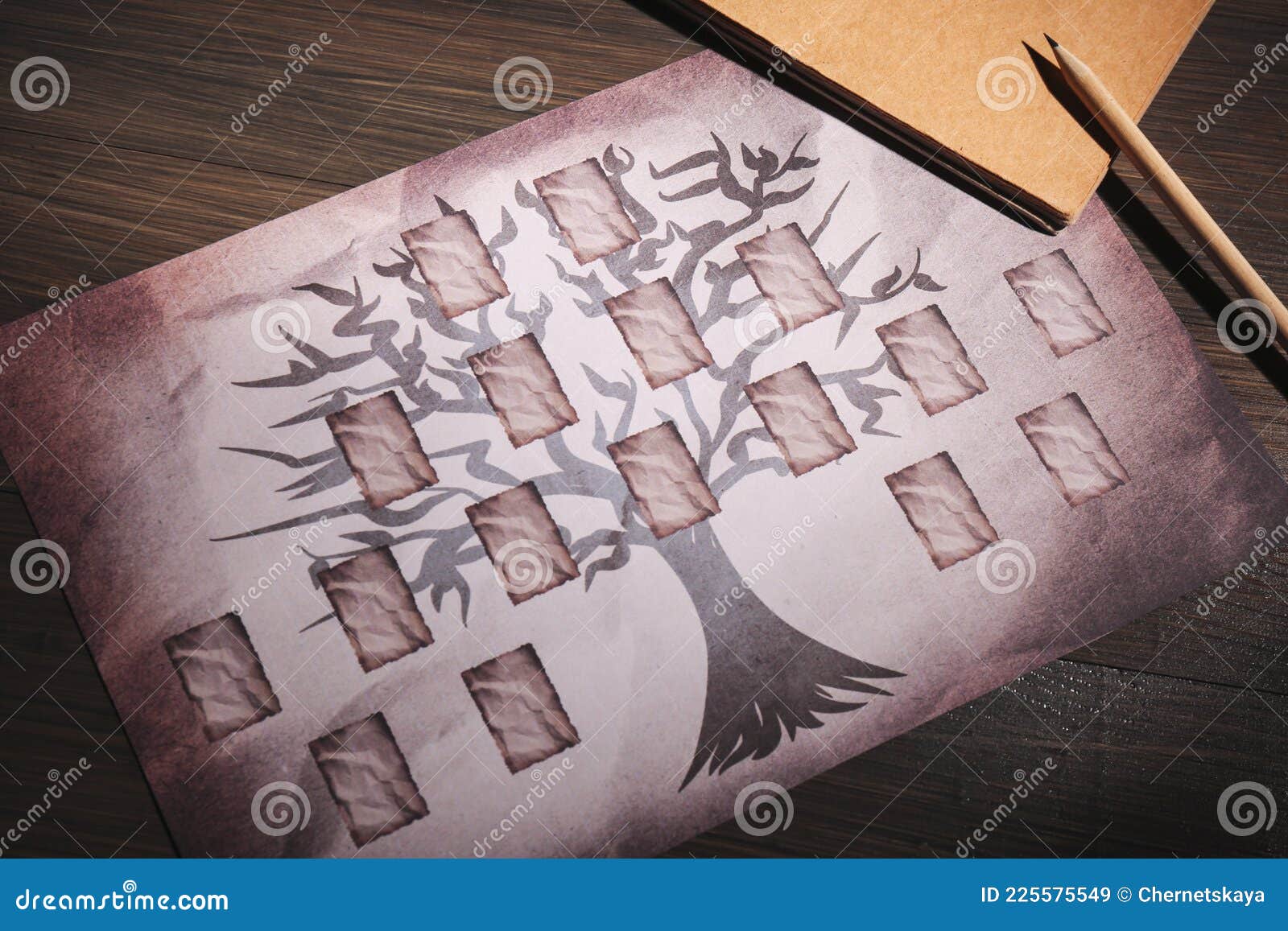 blank family tree, notebook and pencil on wooden table