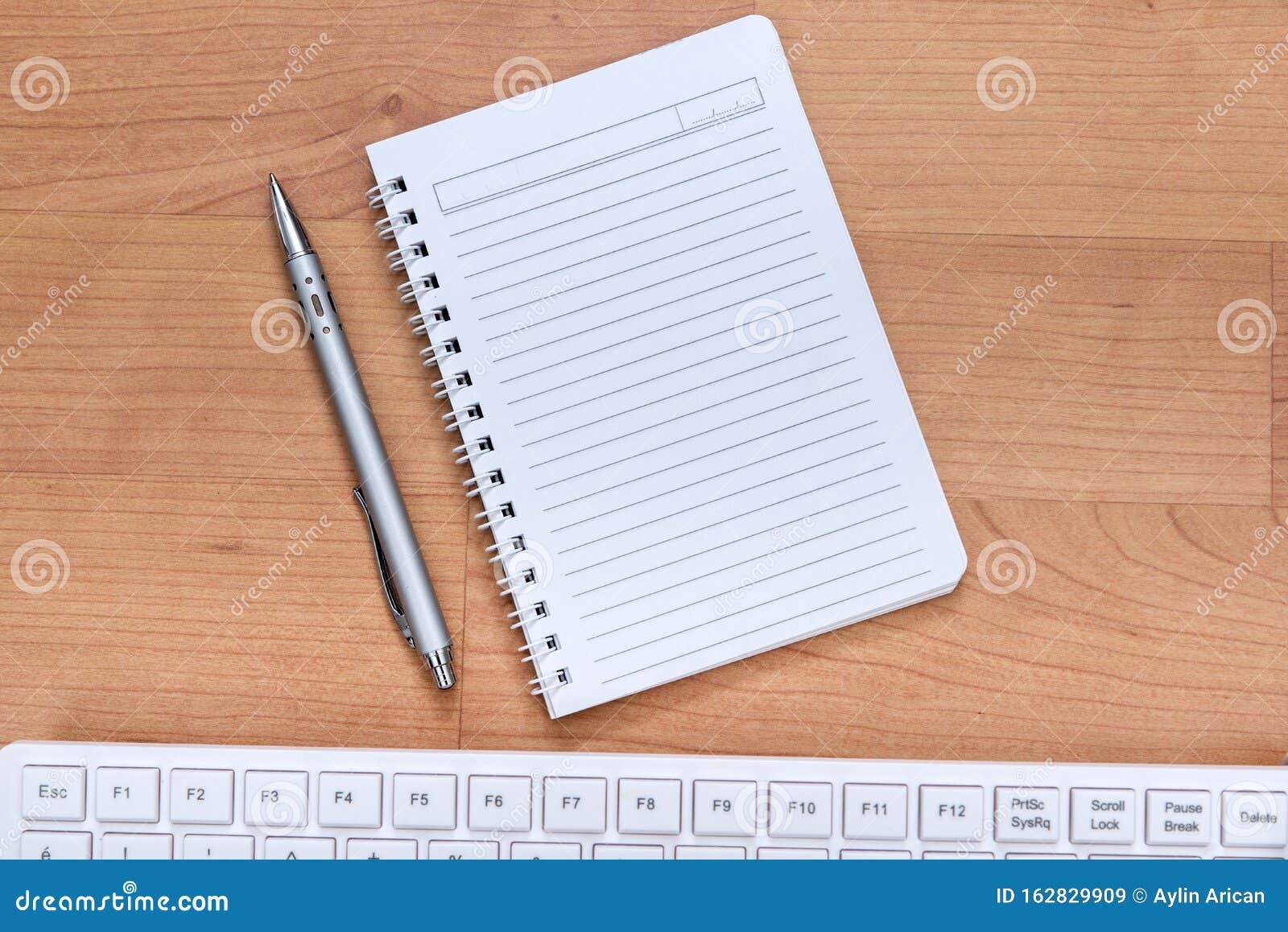 blank notebook and computer keybord on the desk