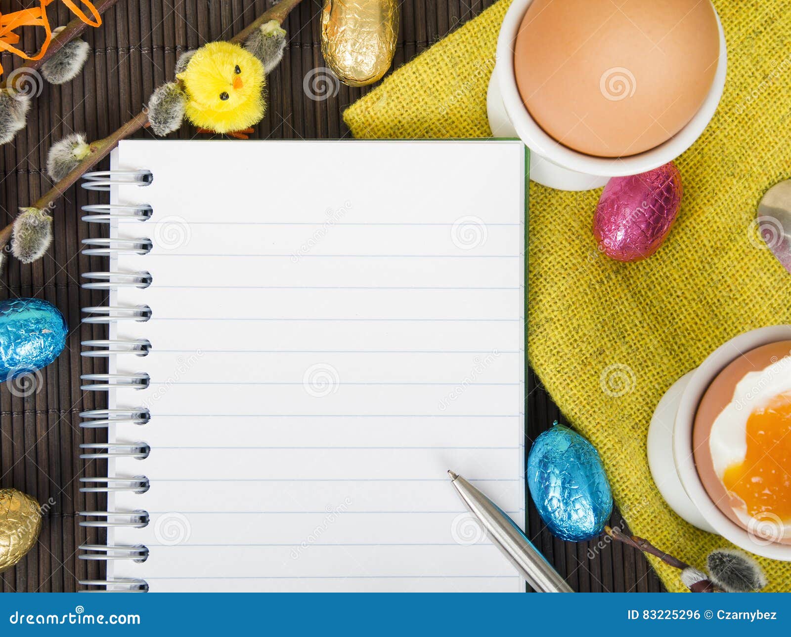 Blank notebook and Easter decorations, shopping list
