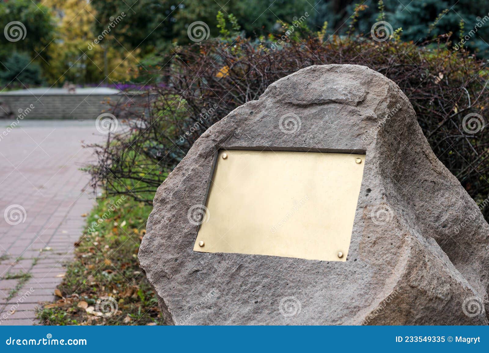 Blank Plaque on the Stone. Bronze Memorial Plaque in the Park. Empty