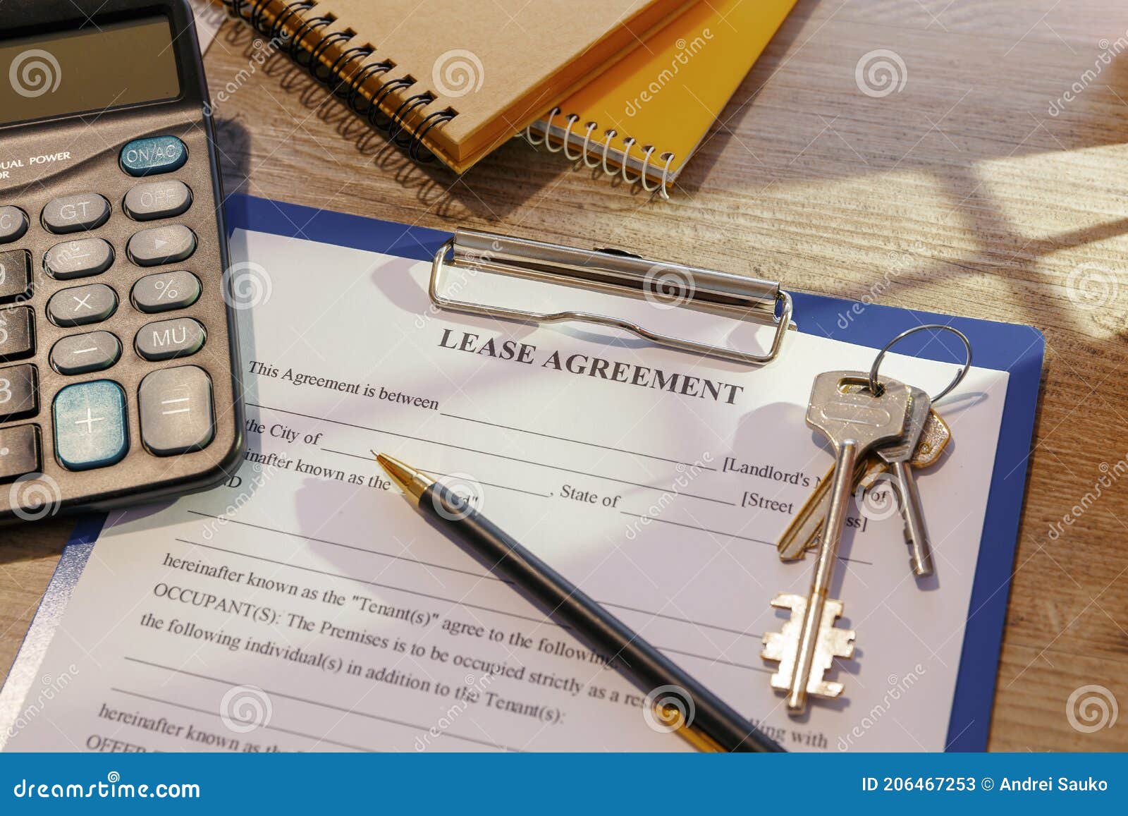 blank real estate lease agreement and keys on office desk