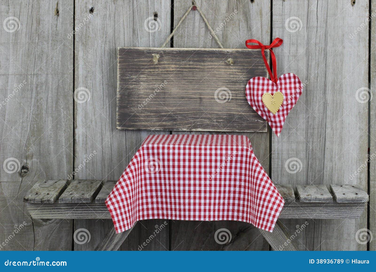 Blank Wood Sign With Red Heart Over Picnic Table Stock
