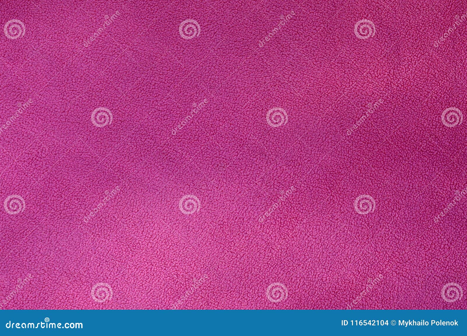 the blanket of furry pink fleece fabric. a background texture of light pink soft plush fleece materia