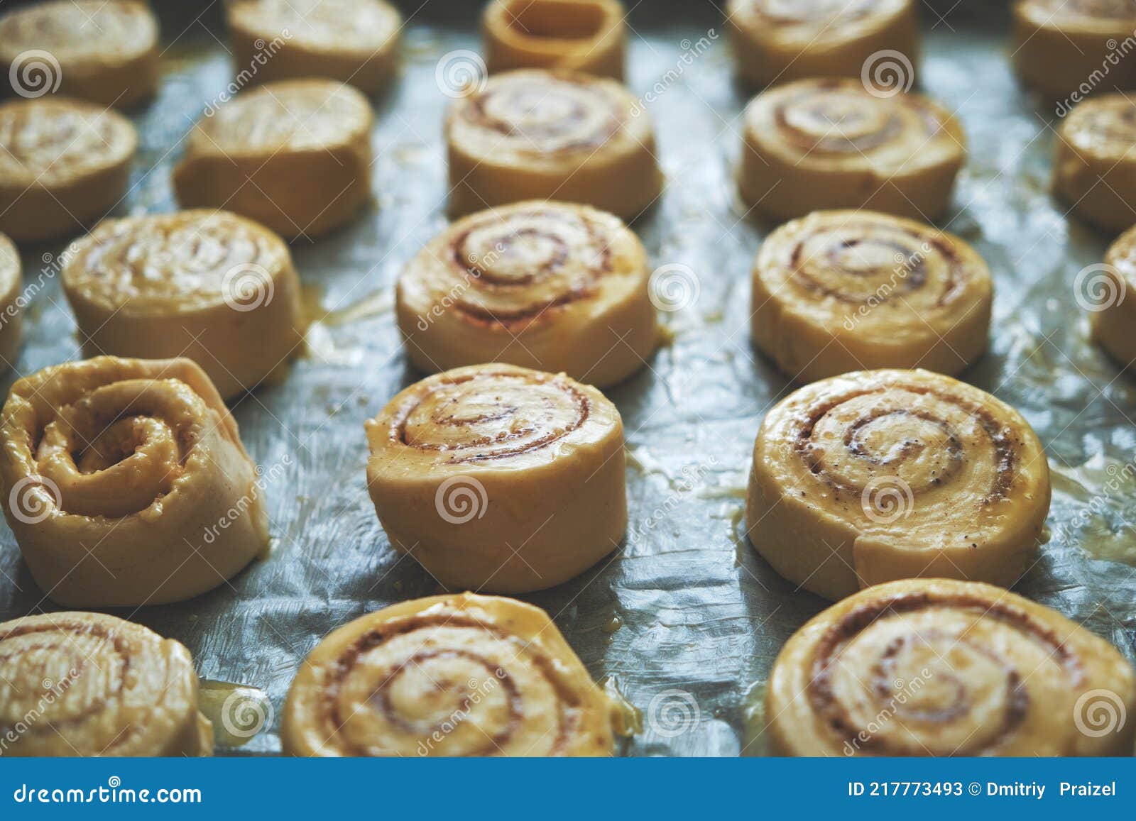 Blanks for Baking Cinnamon Rolls on Baking Sheet with Parchment Paper