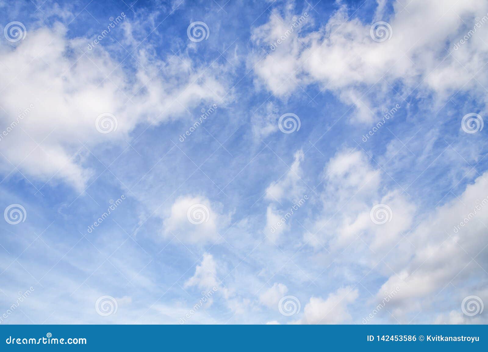 blue sky with cirro cumulus and puffy white clouds. sky background