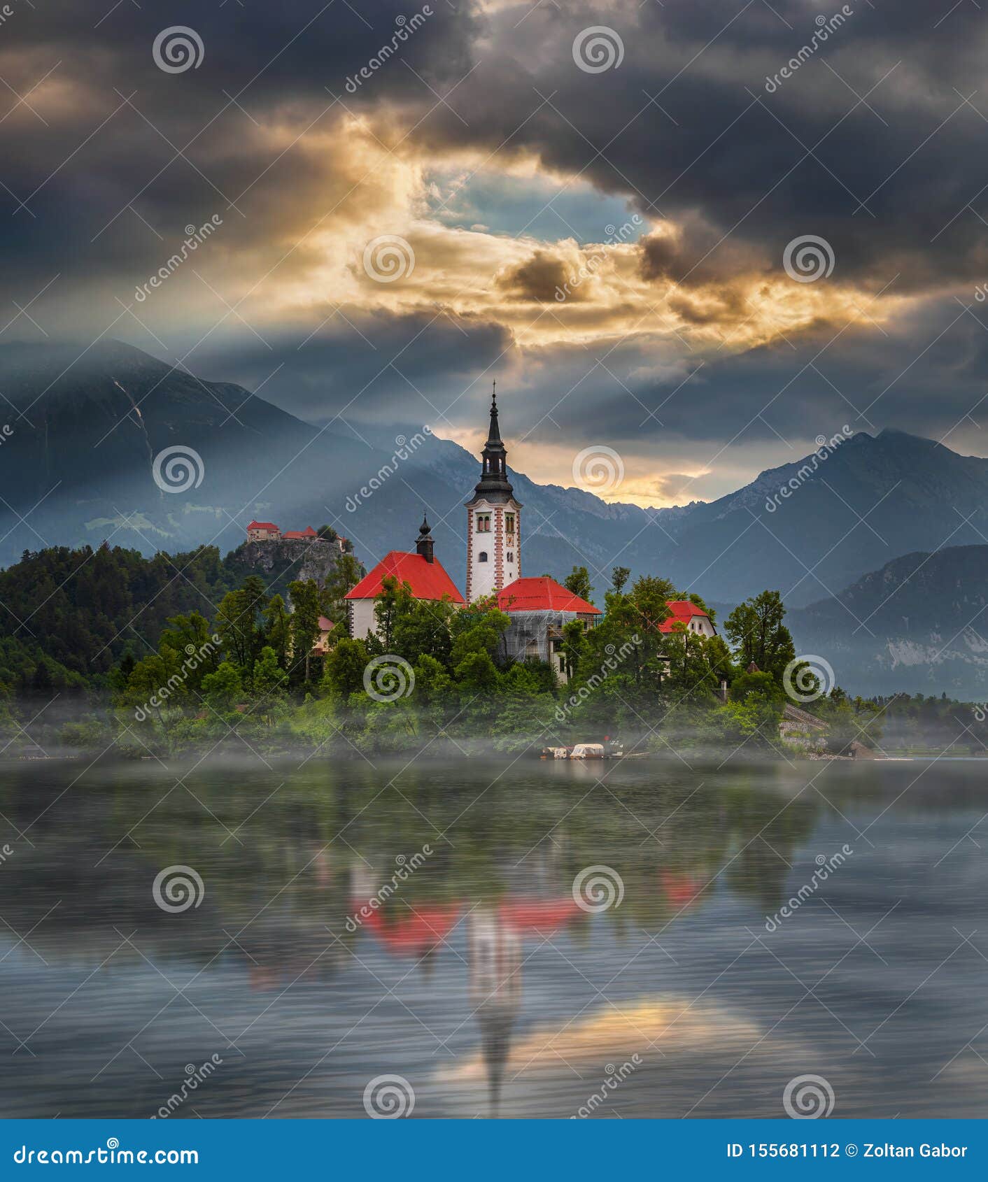 bled, slovenia - misty sunrise at lake bled blejsko jezero with the pilgrimage church of the assumption of maria on an island