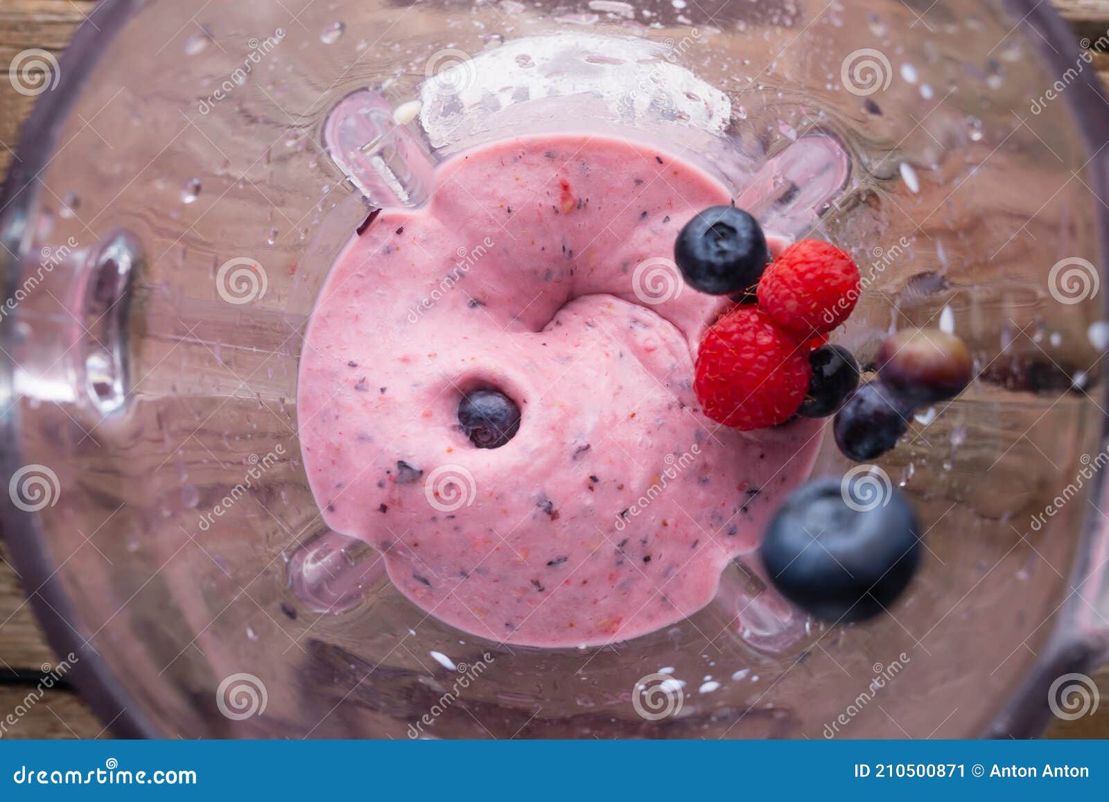 blender top view whips berries raspberry blueberries banana preparation smoothie smoothie healthy food