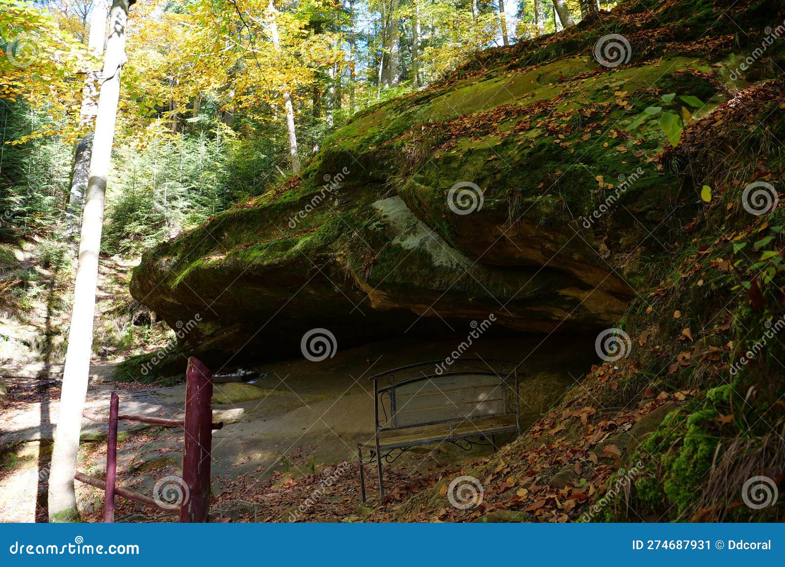 blessed stone and sacred spring in forest near manyava skete in ukraine