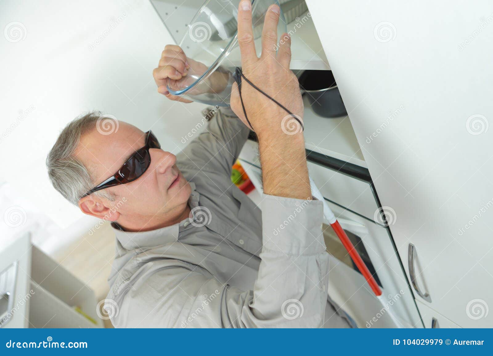 Blind man alone in kitchen stock image. Image of handicap 104029979