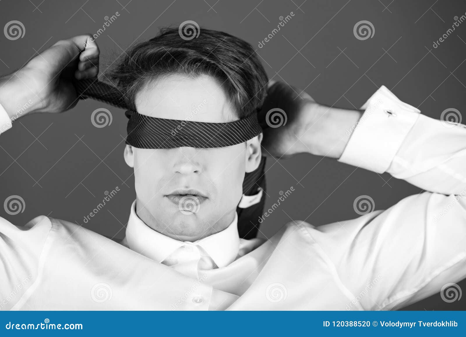 Blind Way of Life. Blindfolded Man with Tie on Eyes in White Shirt