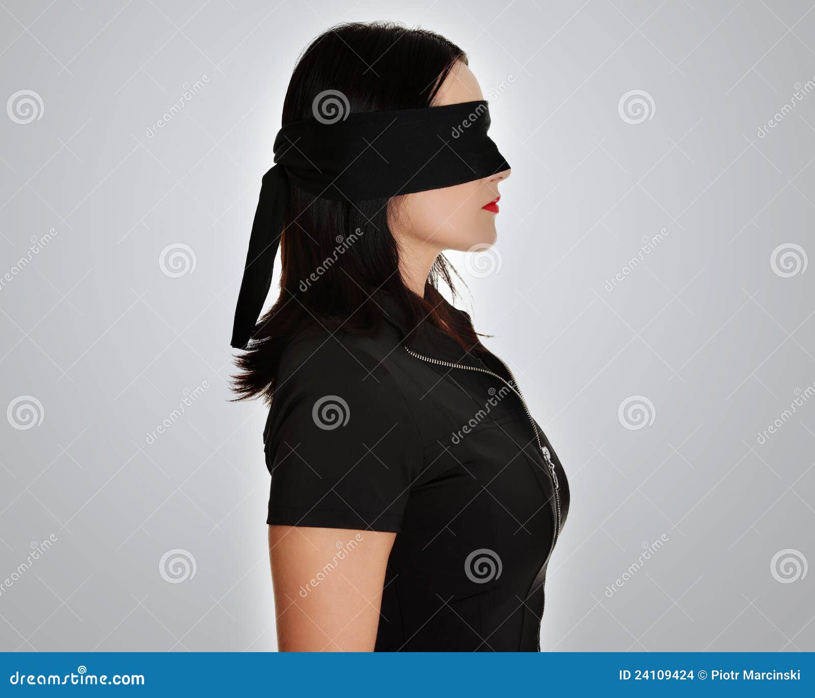 Young Woman Wearing Black Blindfold Isolated On Grey Stock Photo