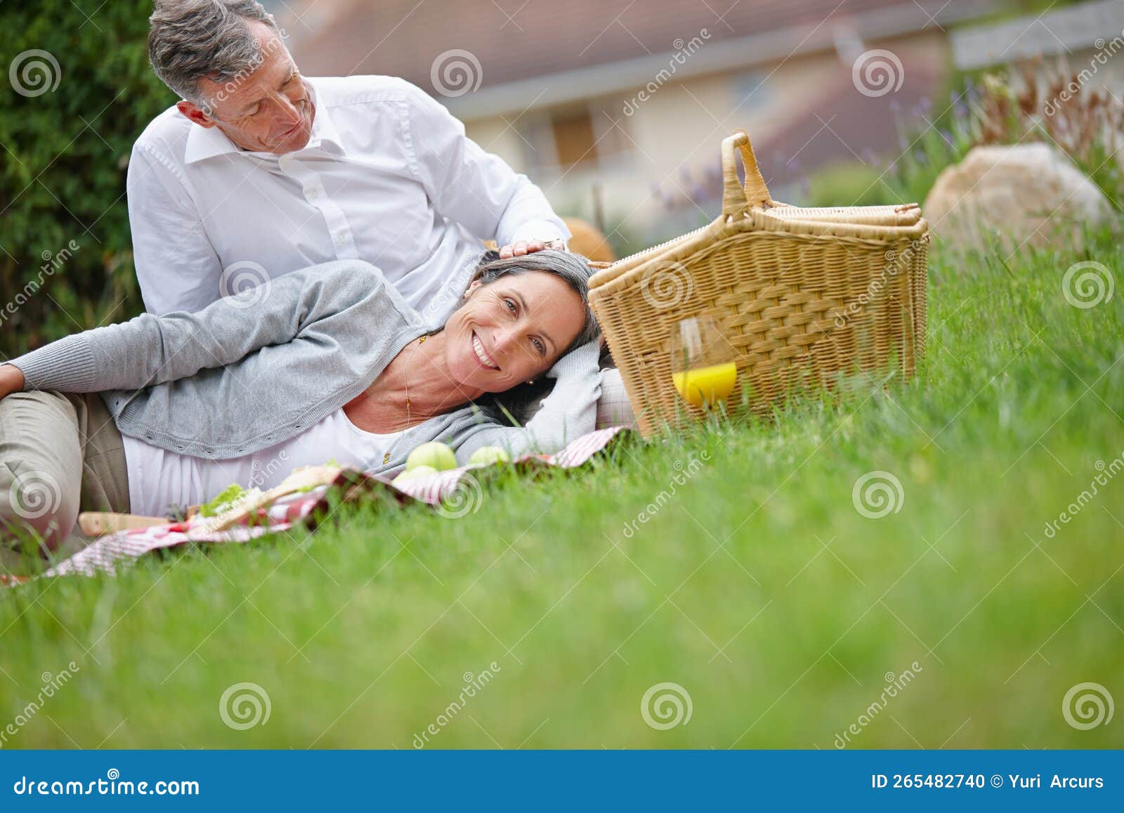 This Is Bliss A Loving Mature Couple Having A Picnic On The Grass