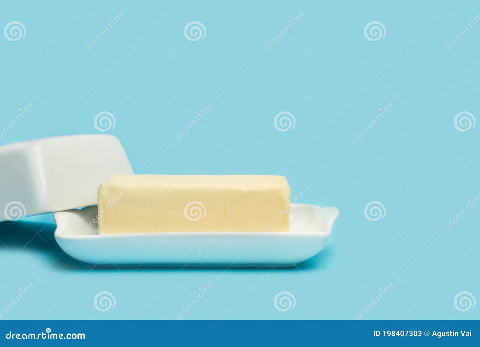A Block of Butter on an Open Withe Butter Dish Stock Image Image of