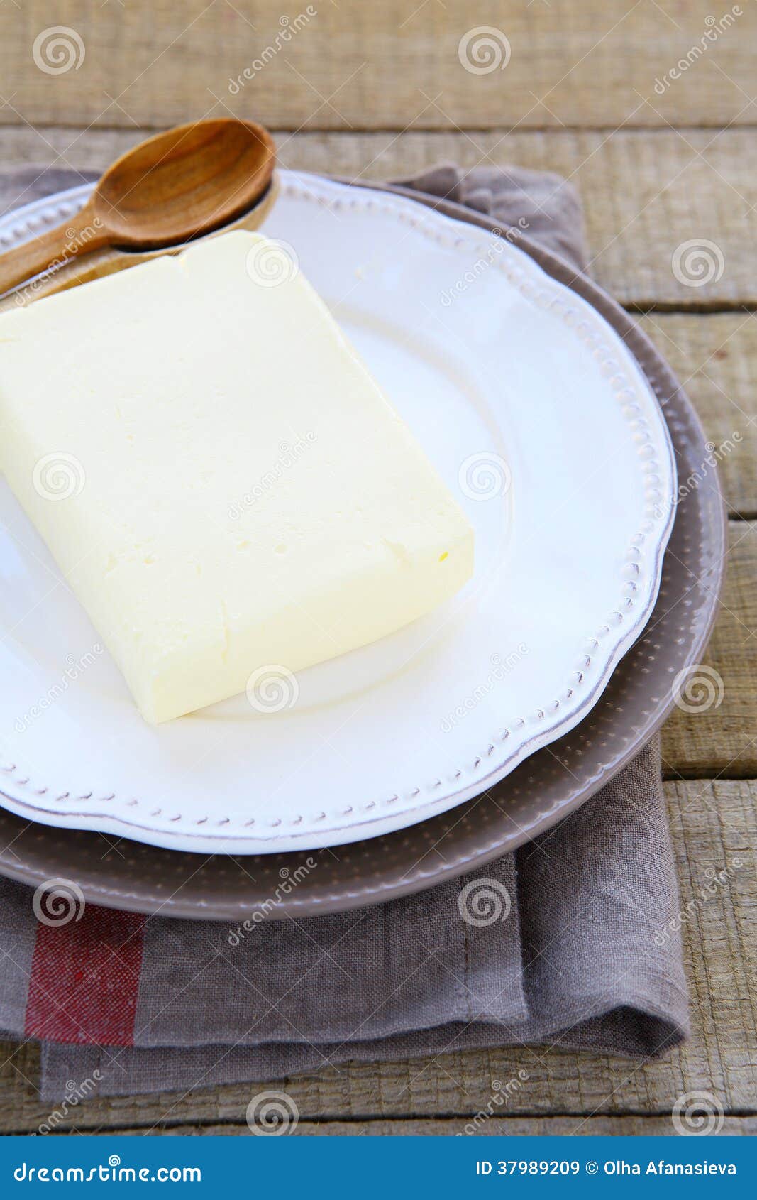 Block of butter on a plate stock image. Image of margarine 37989209