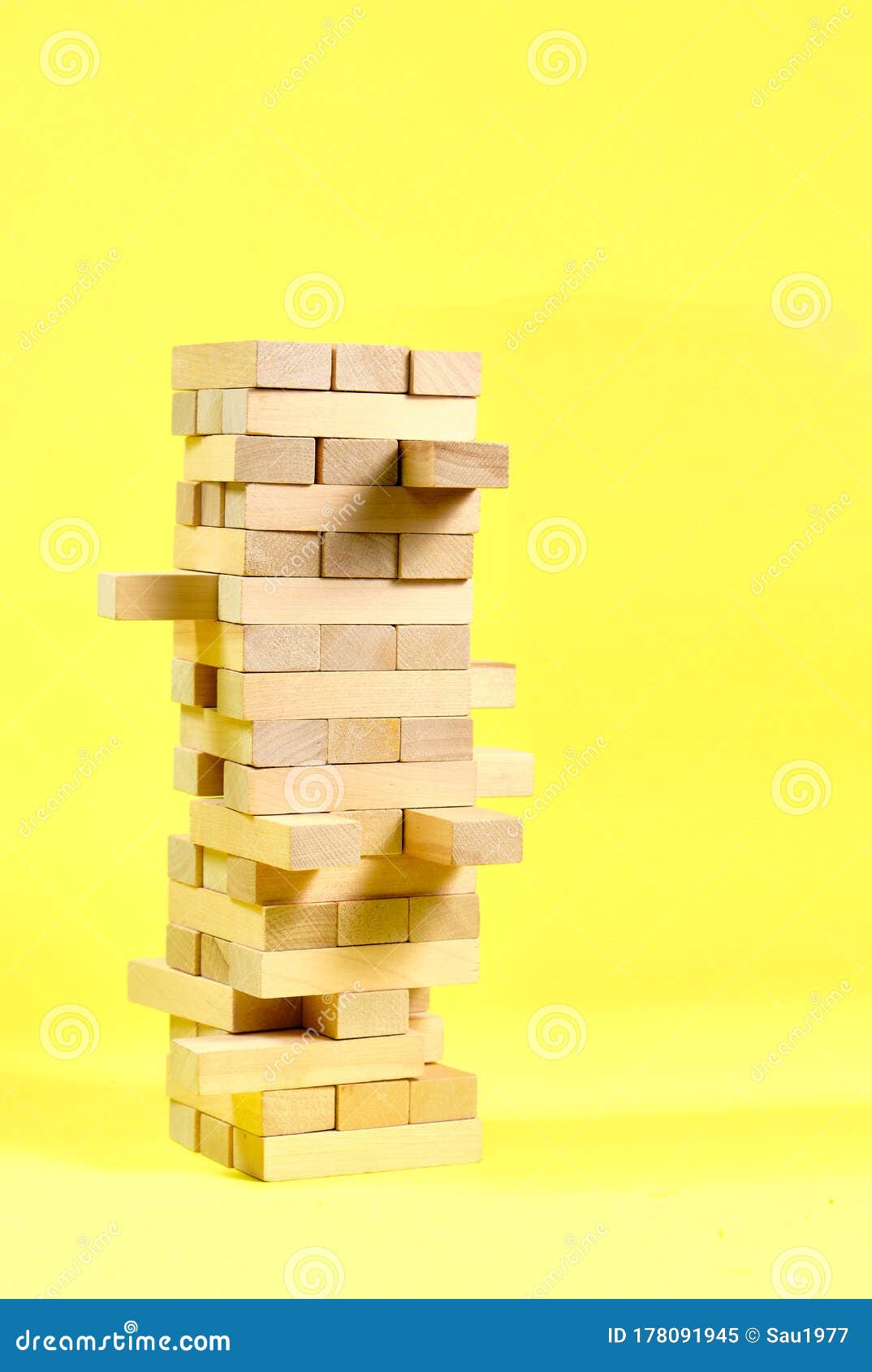 Blocks of the Wooden Game Jenga on a Yellow Background, Space for Text ...