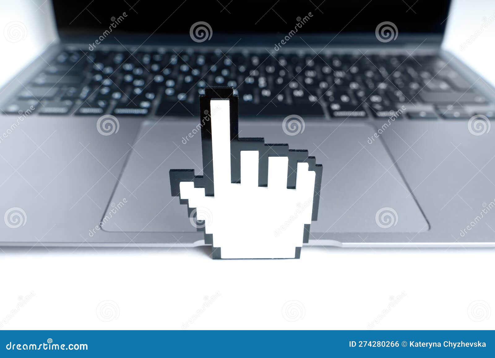 blocky hand d mouse pointer toy model by a laptop