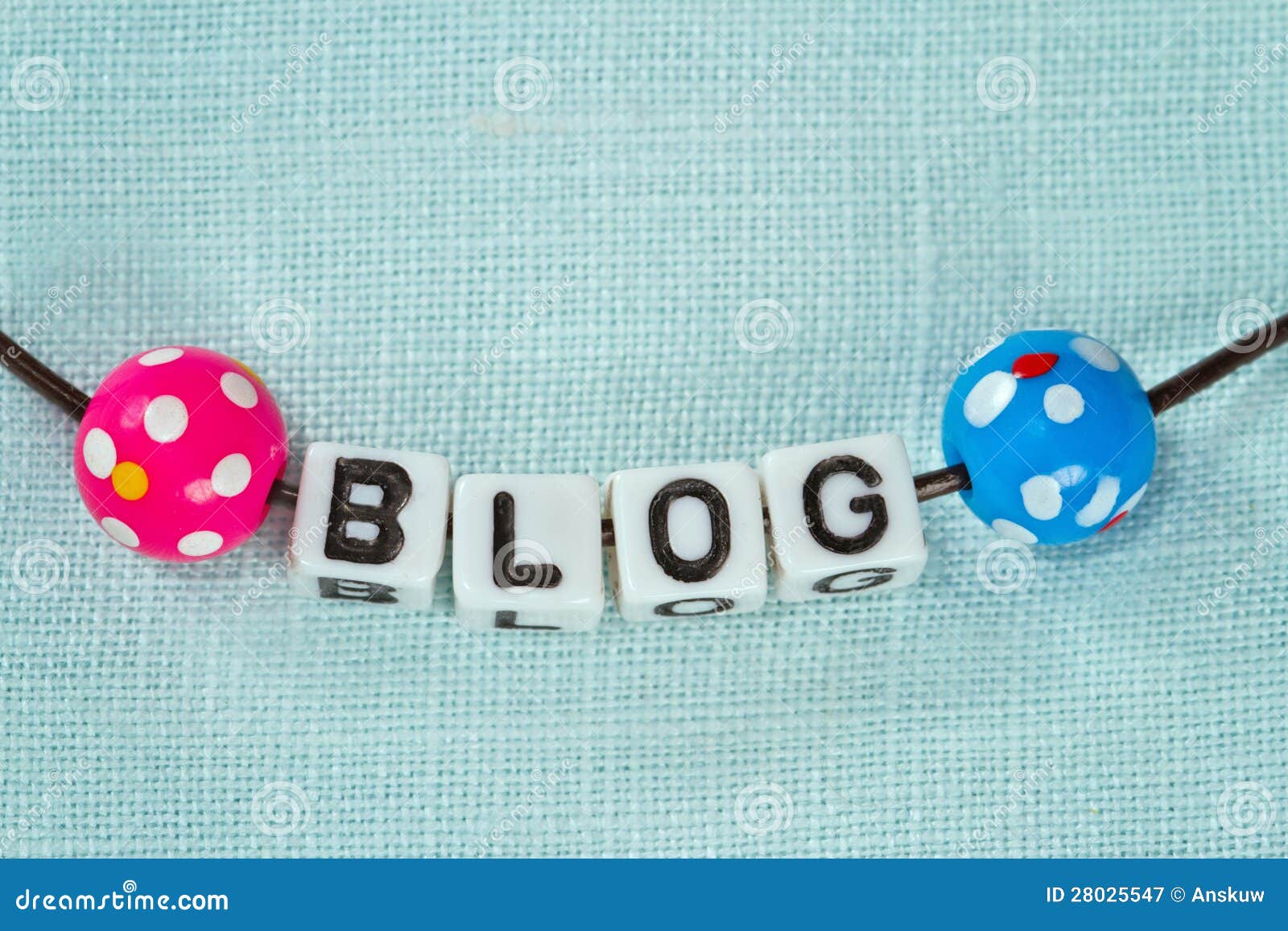 blogging concept - letters on blue fabric