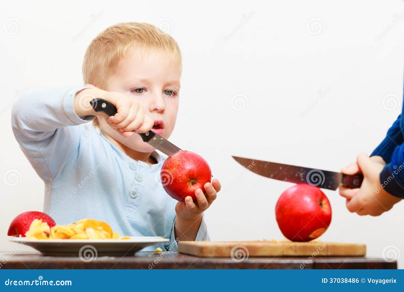 Blond Boy Child Kid Preschooler With Kitchen Knife Cutting 