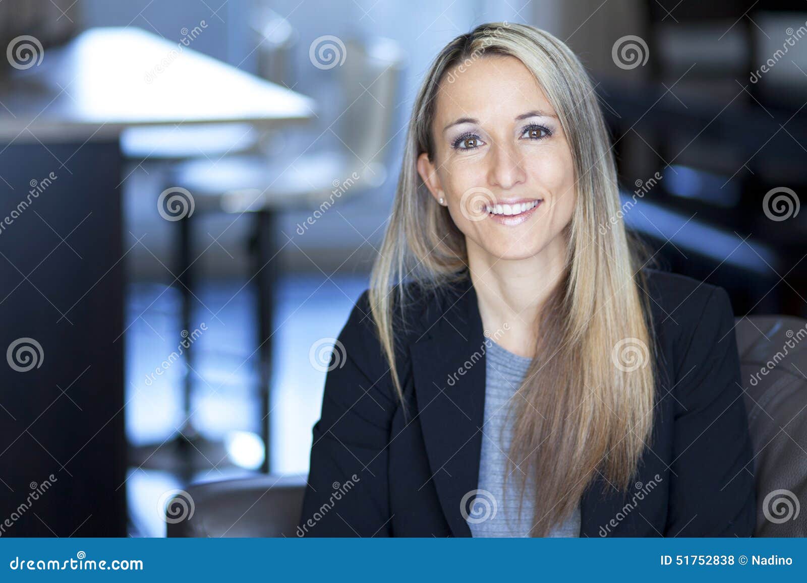 blond confident businesswoman smiling