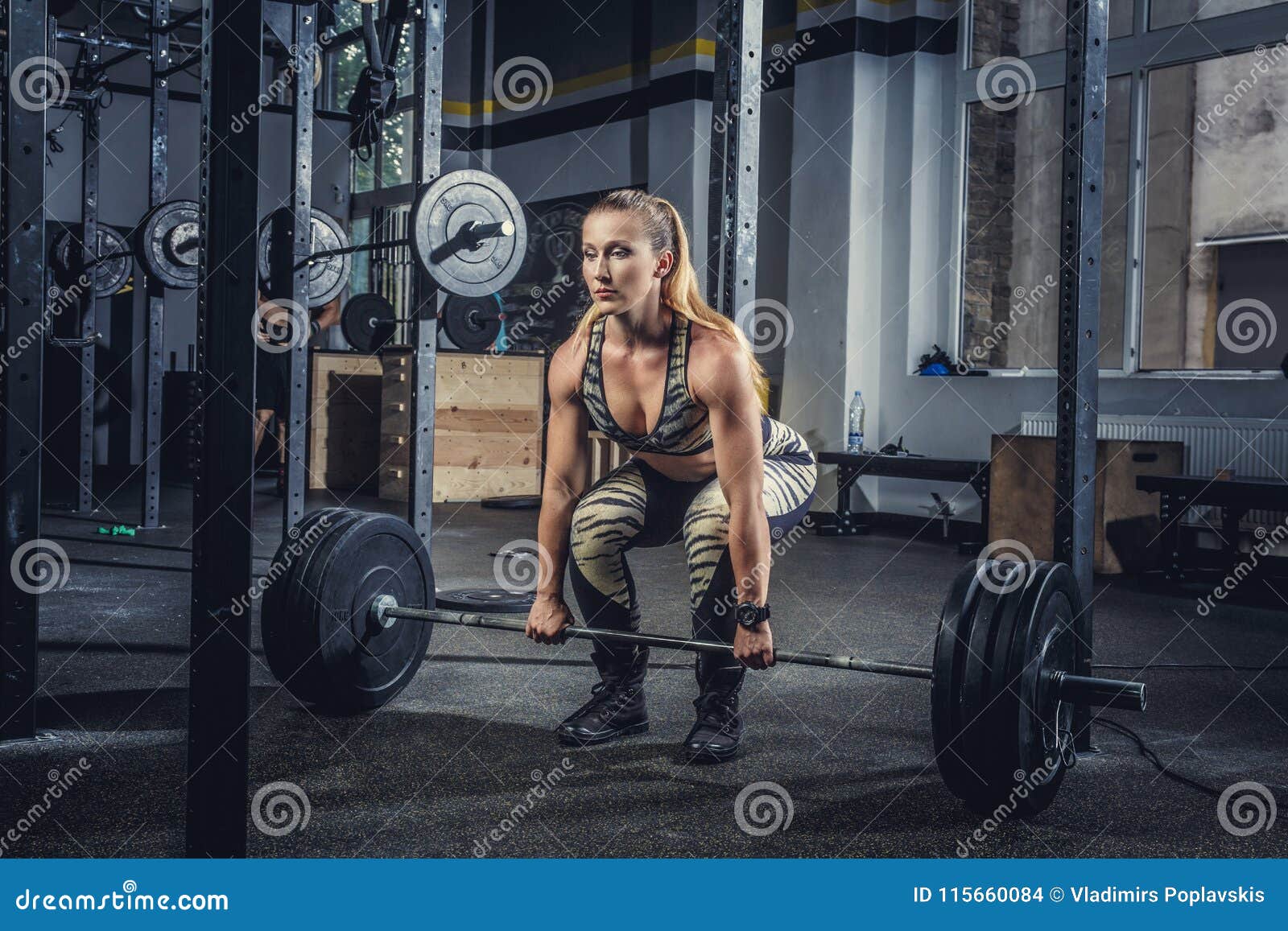 Blond Female Holding Barbell in Gym Club. Stock Photo - Image of ...