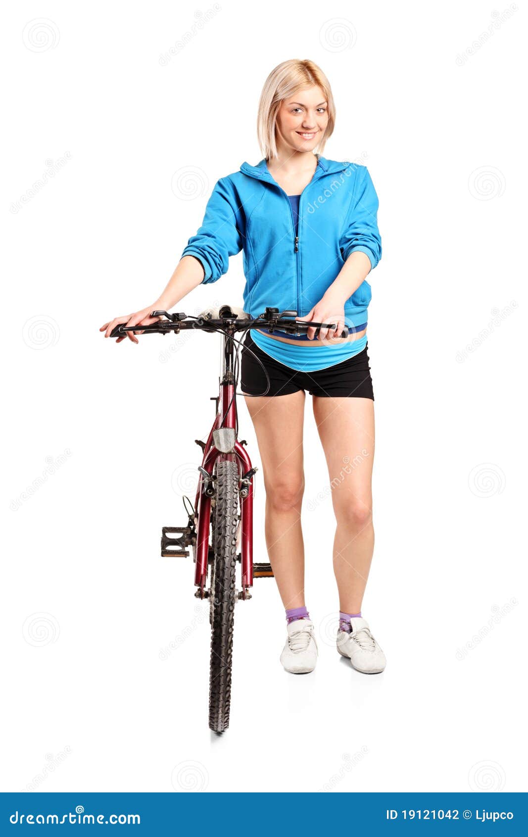 A Blond Female Posing Next To a Bicycle Stock Photo Image of biking